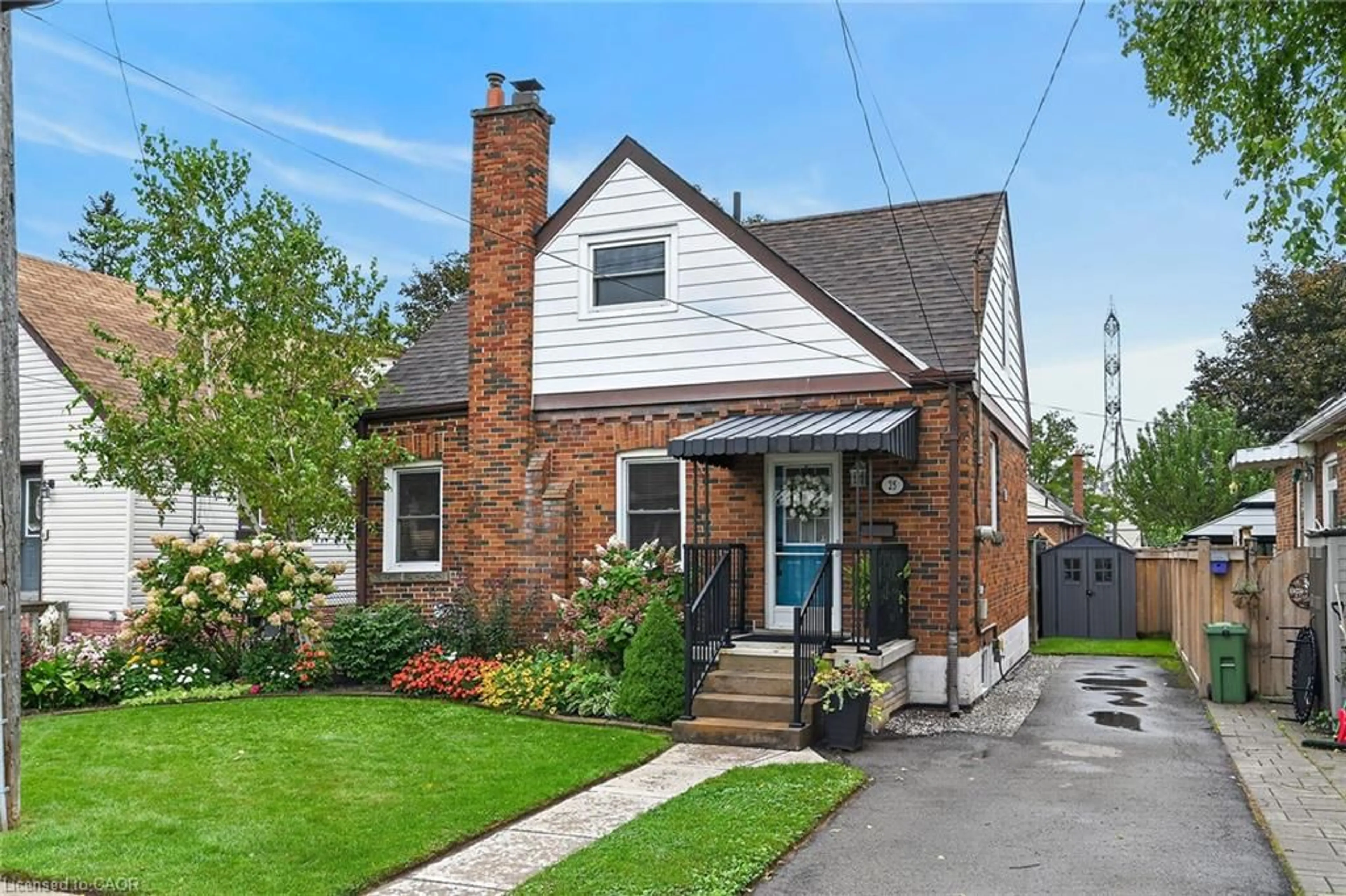 Home with brick exterior material, street for 25 Woodbridge Rd, Hamilton Ontario L8K 3C6