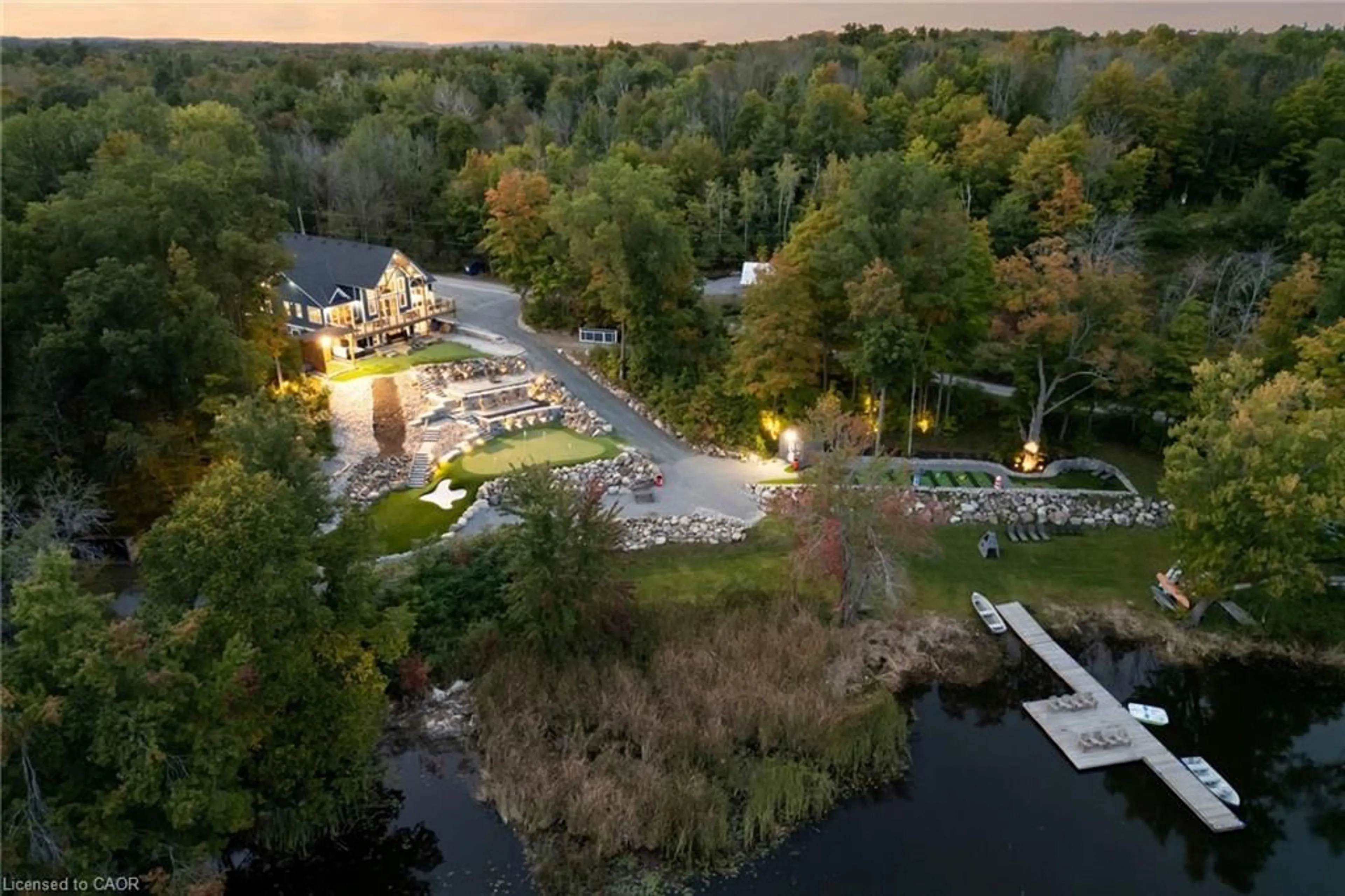 A pic from outside/outdoor area/front of a property/back of a property/a pic from drone, water/lake/river/ocean view for 527 Pine Point Lane, Madoc Ontario K0K 2K0
