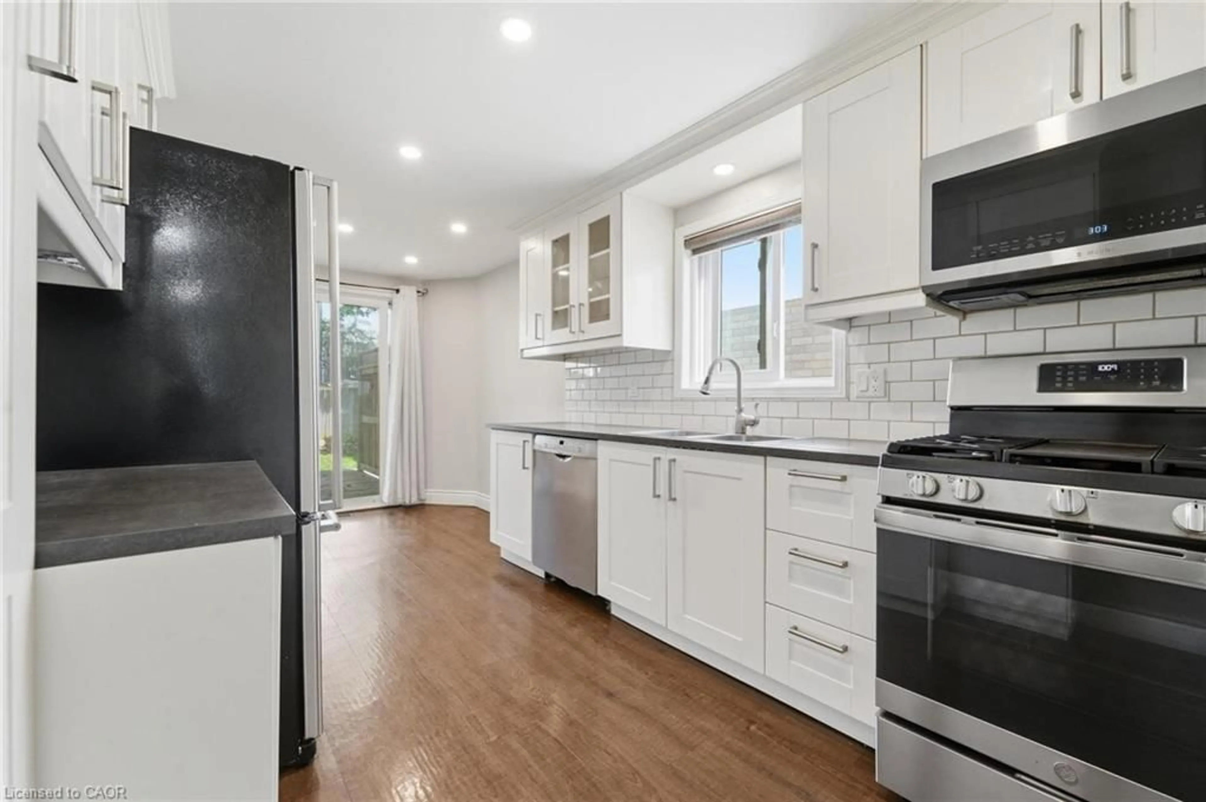 Open concept kitchen, ceramic/tile floor for 449 Exmoor St, Waterloo Ontario N2K 3T7