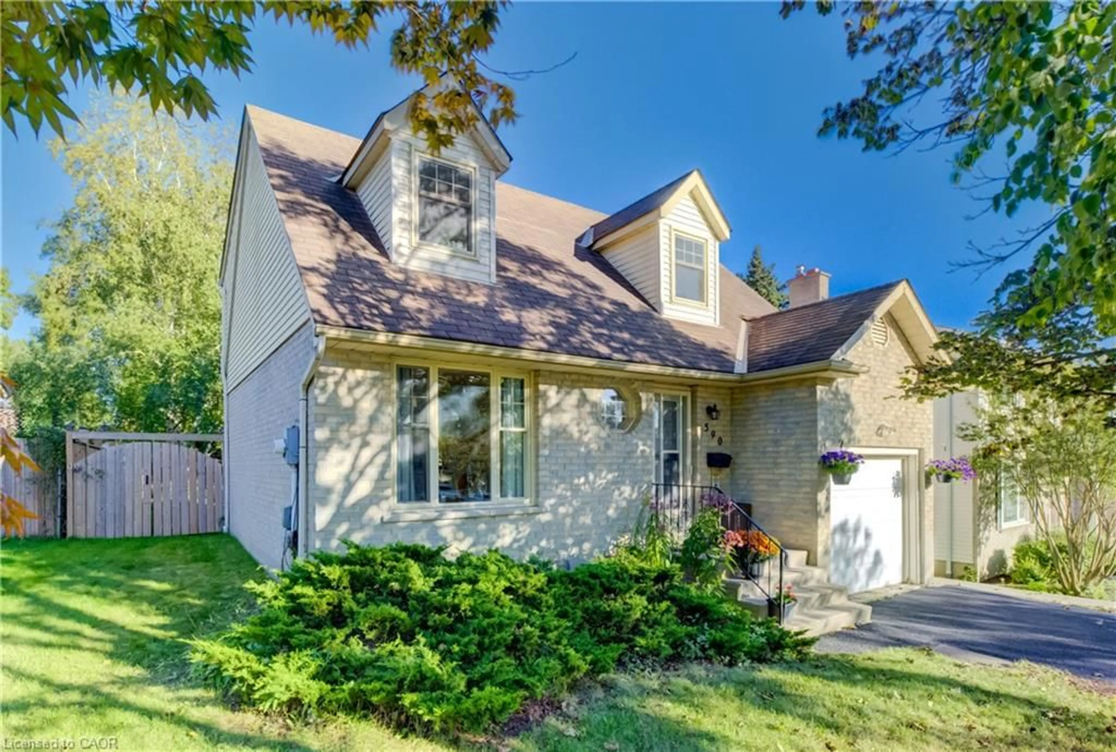 Home with brick exterior material, street for 590 Willow Rd, Guelph Ontario N1H 7M5