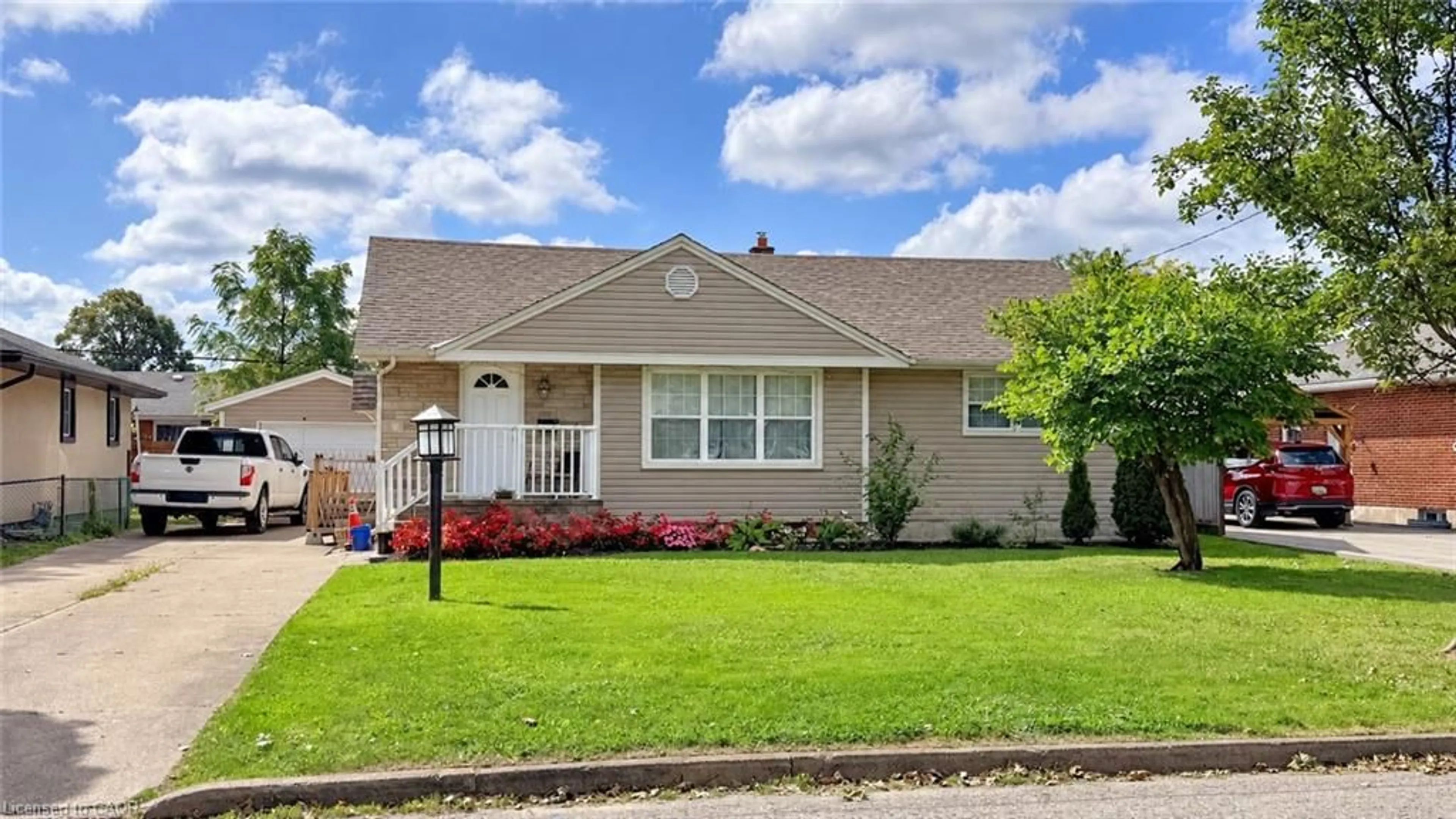 Home with vinyl exterior material, street for 12 Roseland Ave, St. Catharines Ontario L2M 5Z2
