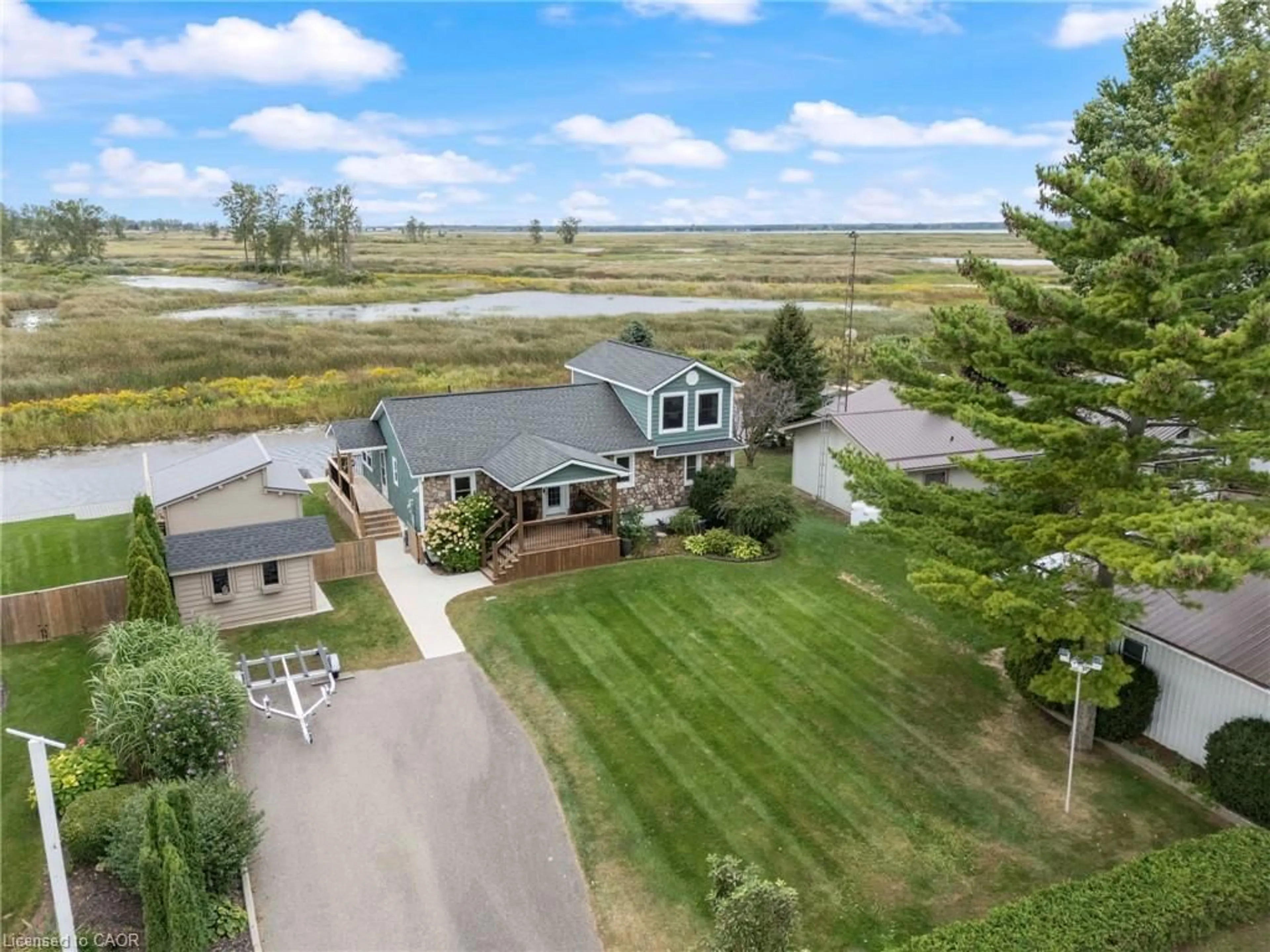 A pic from outside/outdoor area/front of a property/back of a property/a pic from drone, water/lake/river/ocean view for 88 Old Cut Blvd, Long Point Ontario N0E 1M0
