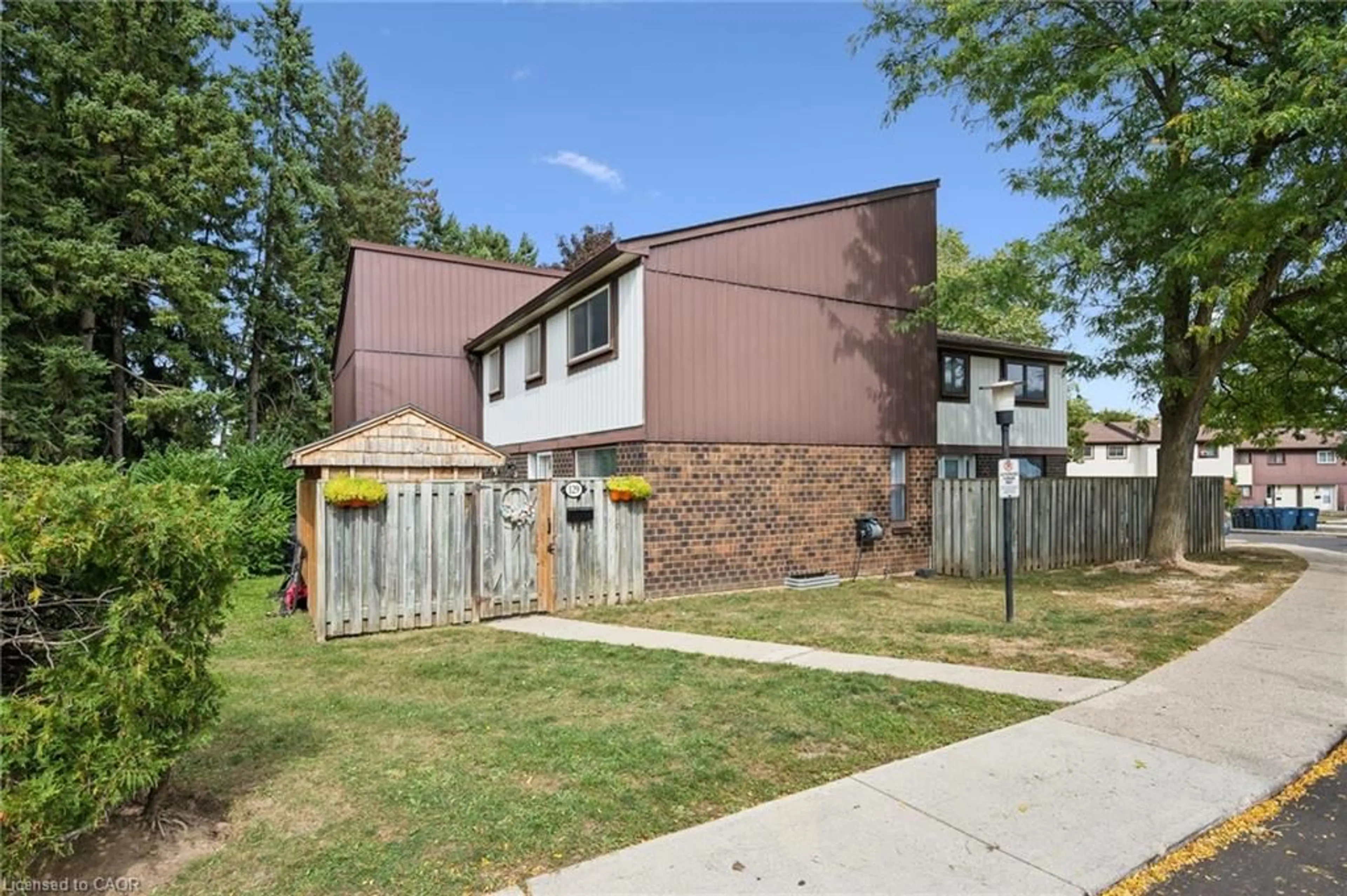 Home with brick exterior material, street for 45 Marksam Rd #129, Guelph Ontario N1G 6Y9