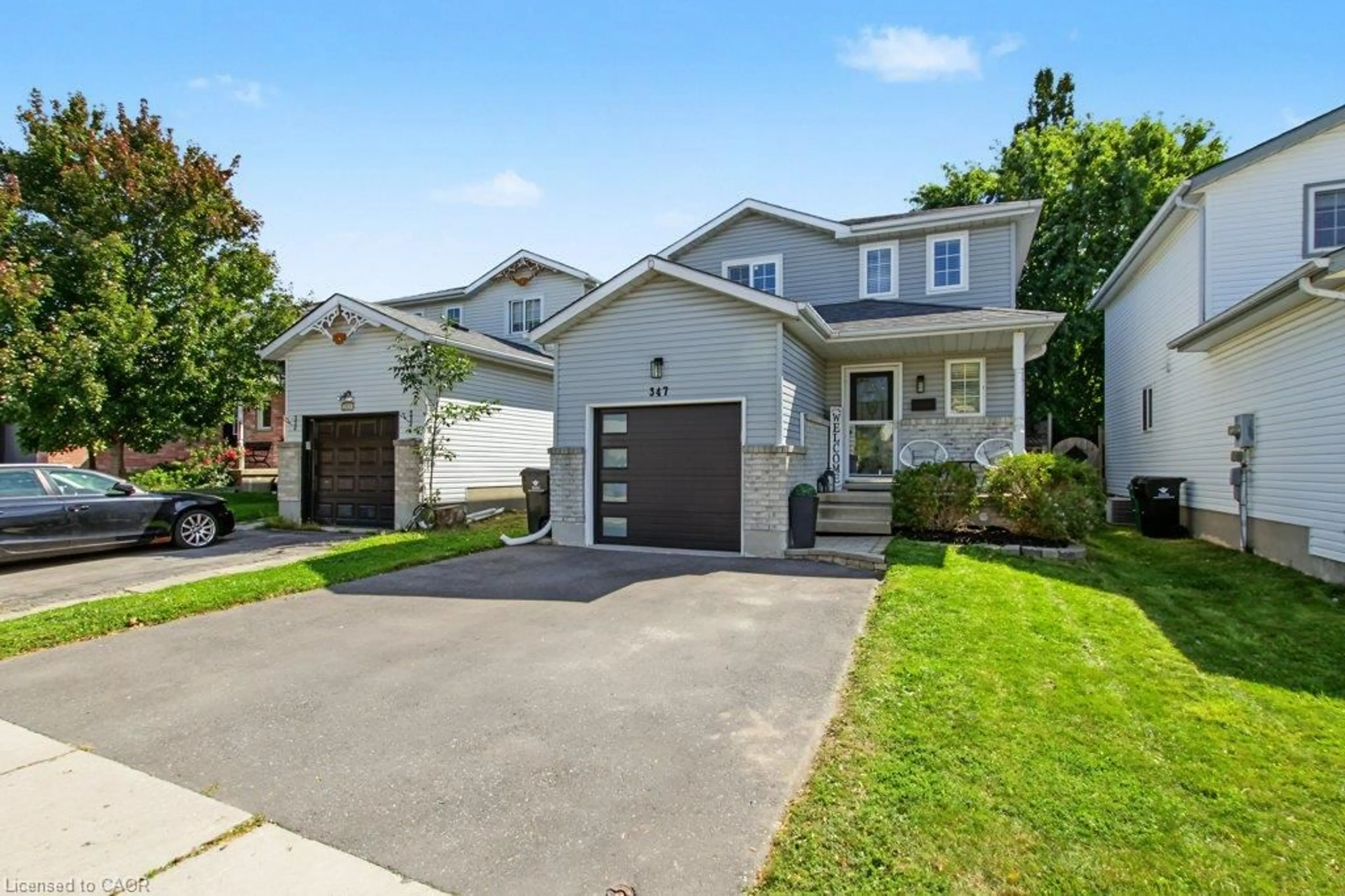 Home with vinyl exterior material, street for 347 Bankside Dr, Kitchener Ontario N2N 3K1