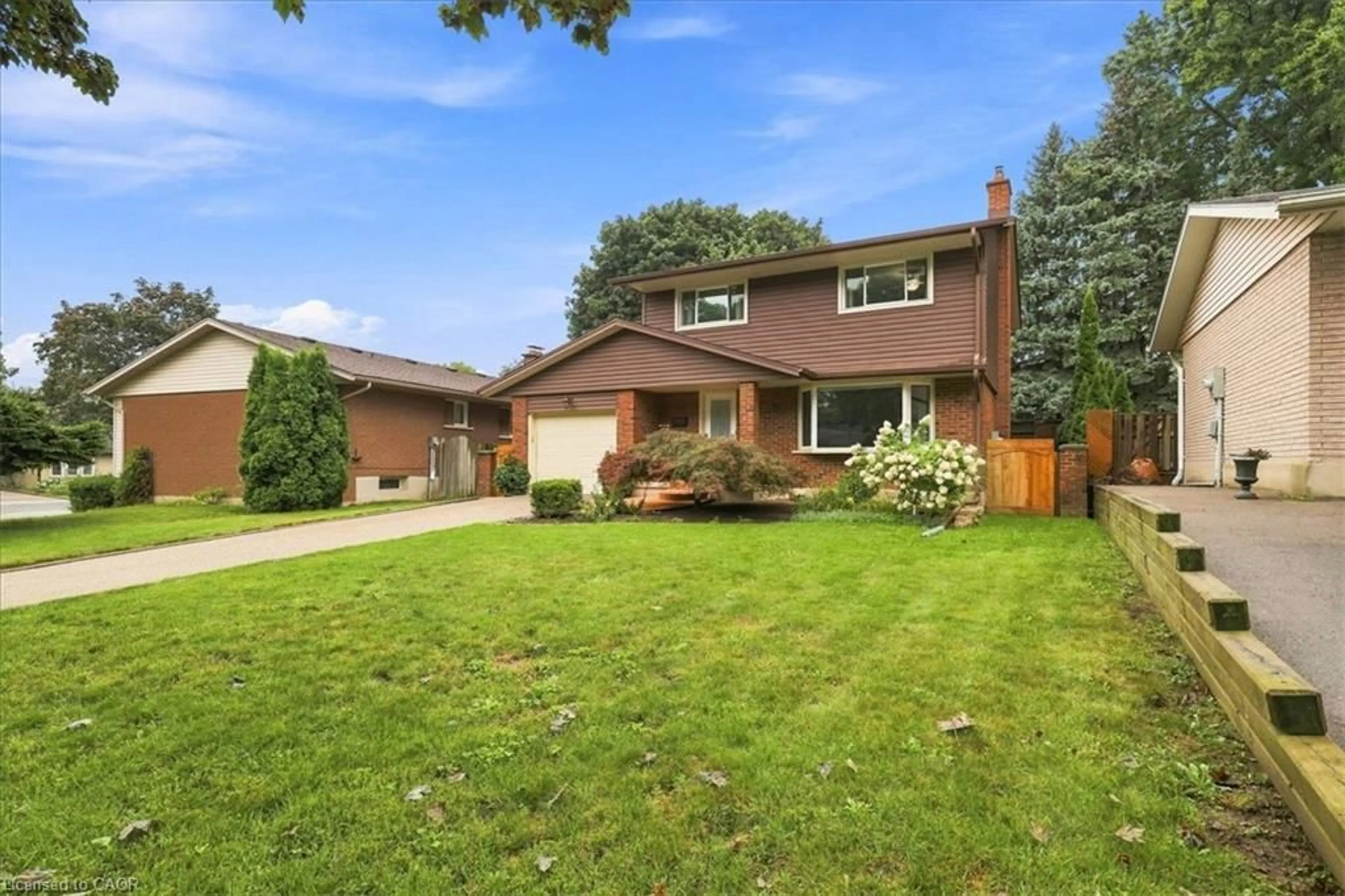 Home with brick exterior material, street for 71 Greenock Dr, Kitchener Ontario N2E 2J9