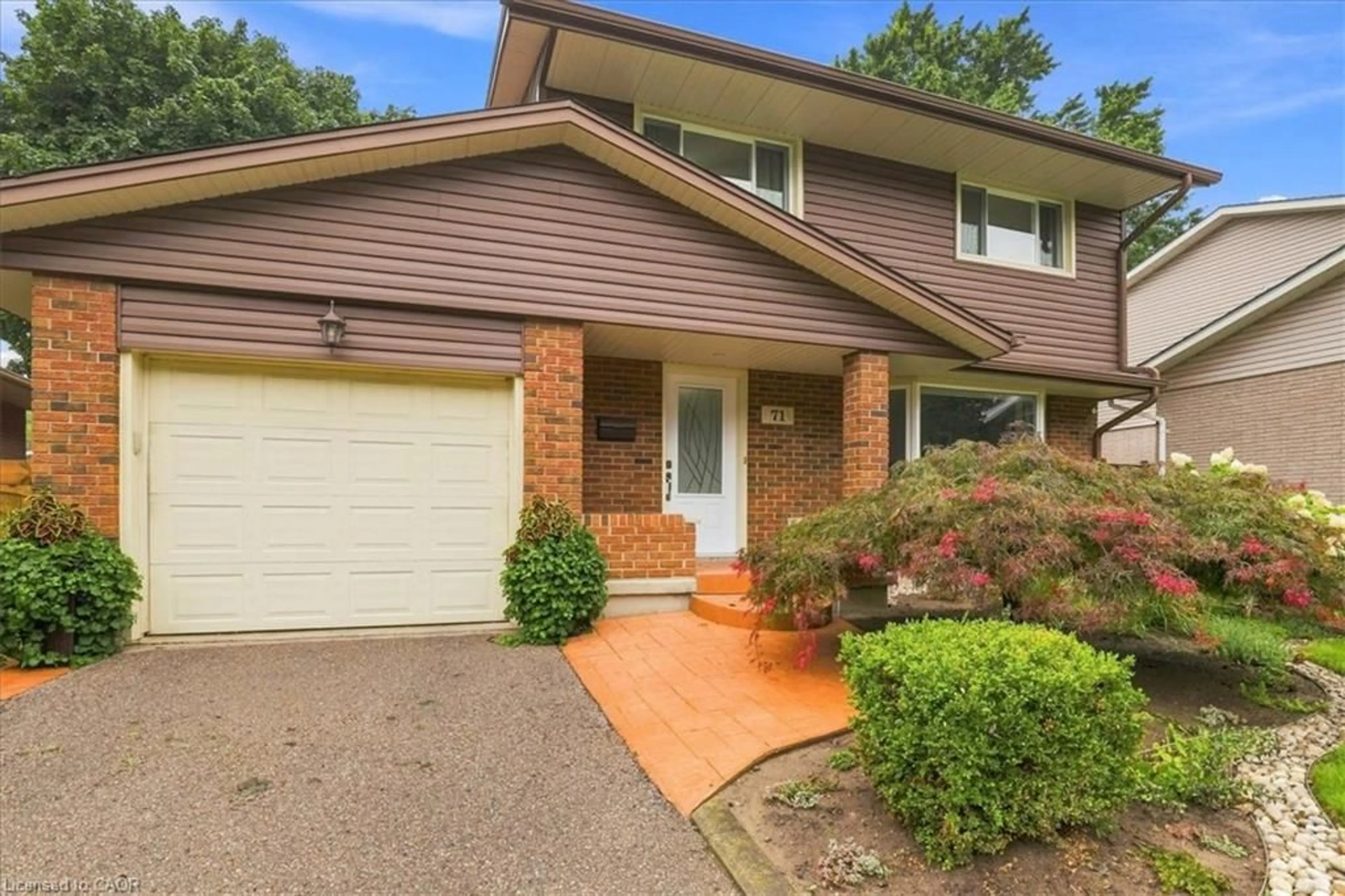 Home with brick exterior material, street for 71 Greenock Dr, Kitchener Ontario N2E 2J9