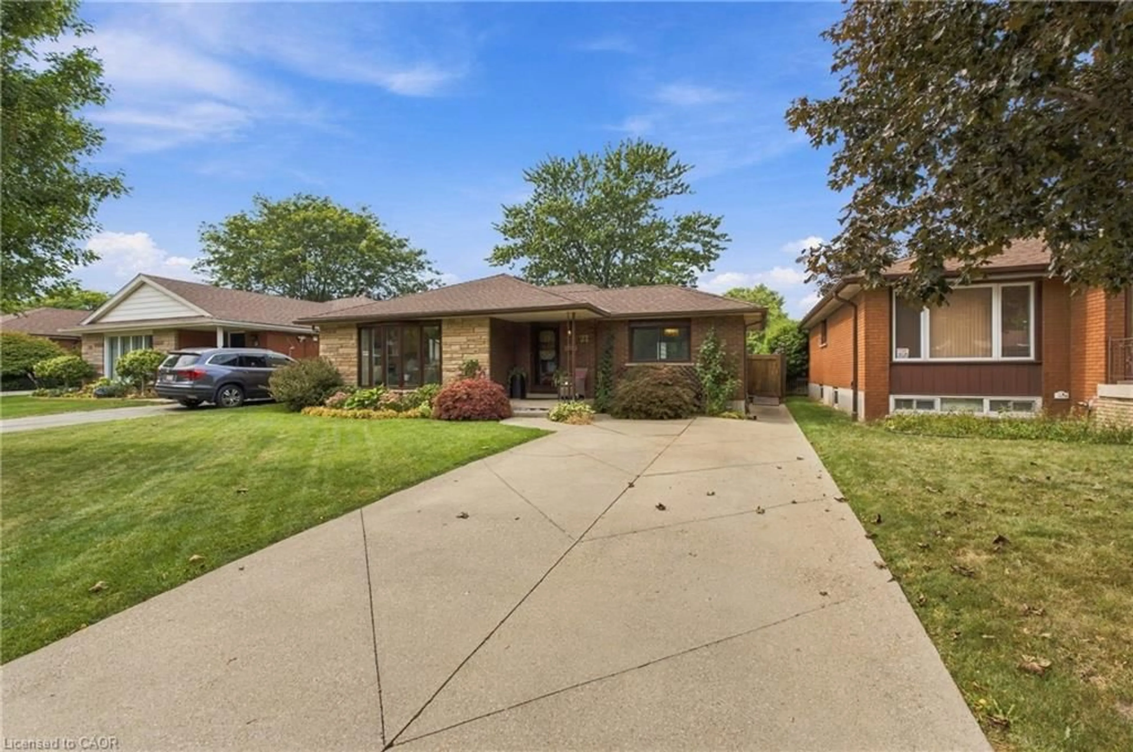 Home with brick exterior material, street for 22 Sycamore St, Hamilton Ontario L8T 3N7