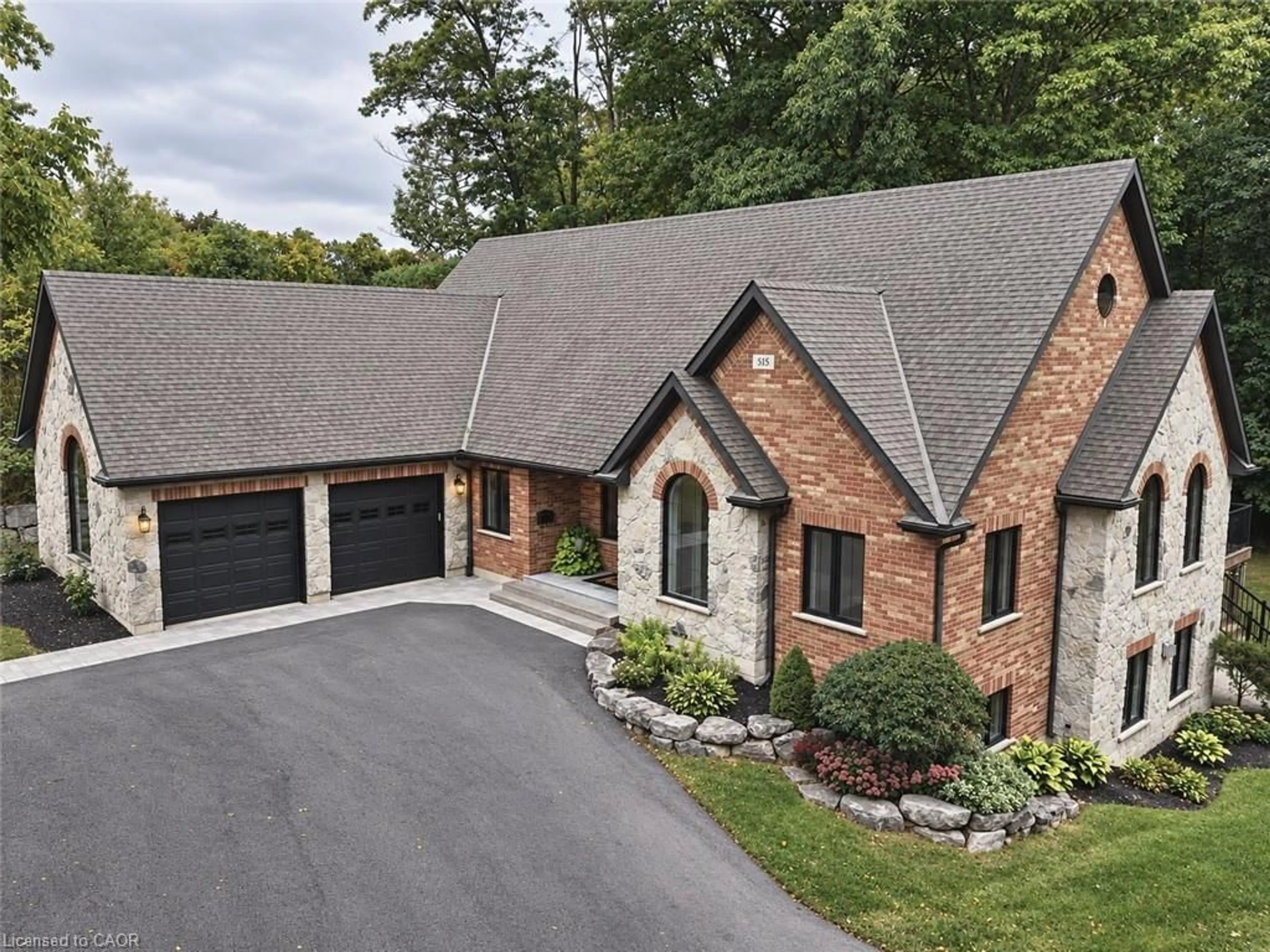 Home with brick exterior material, mountain view for 515 Hamilton Dr, Ancaster Ontario L9G 2A9