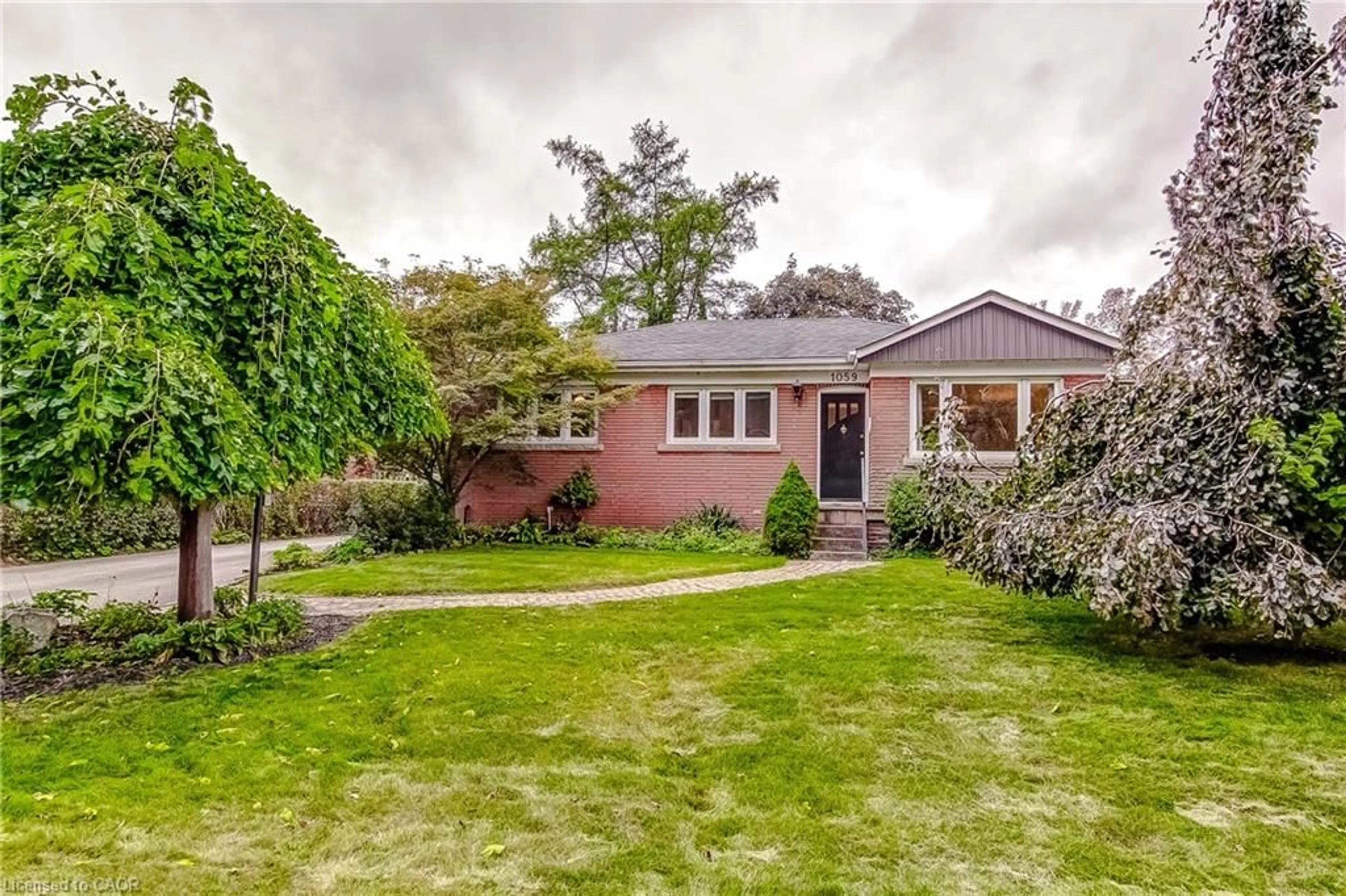 Home with brick exterior material, street for 1059 Shepherds Dr, Burlington Ontario L7T 3R4