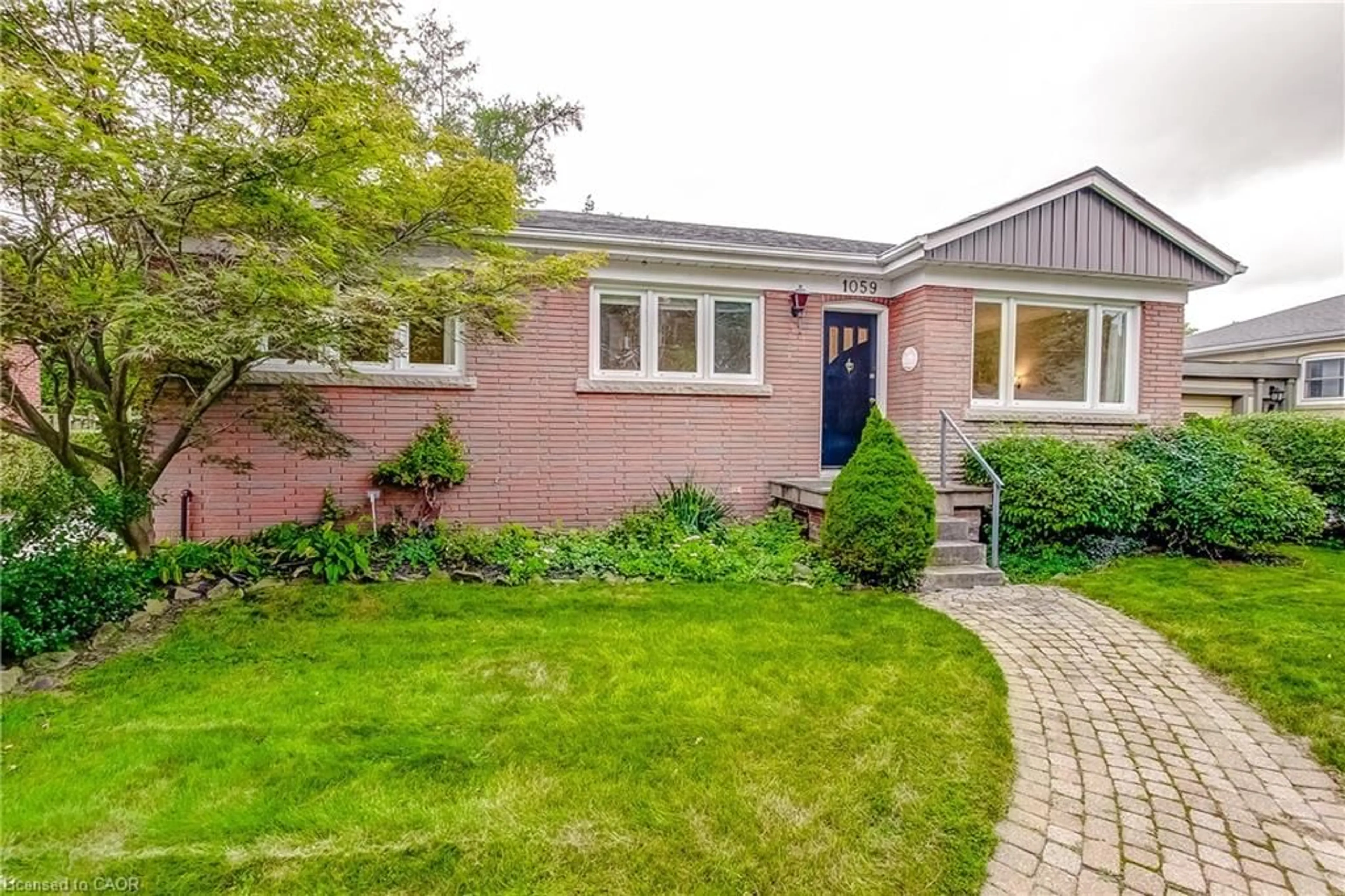 Home with brick exterior material, street for 1059 Shepherds Dr, Burlington Ontario L7T 3R4