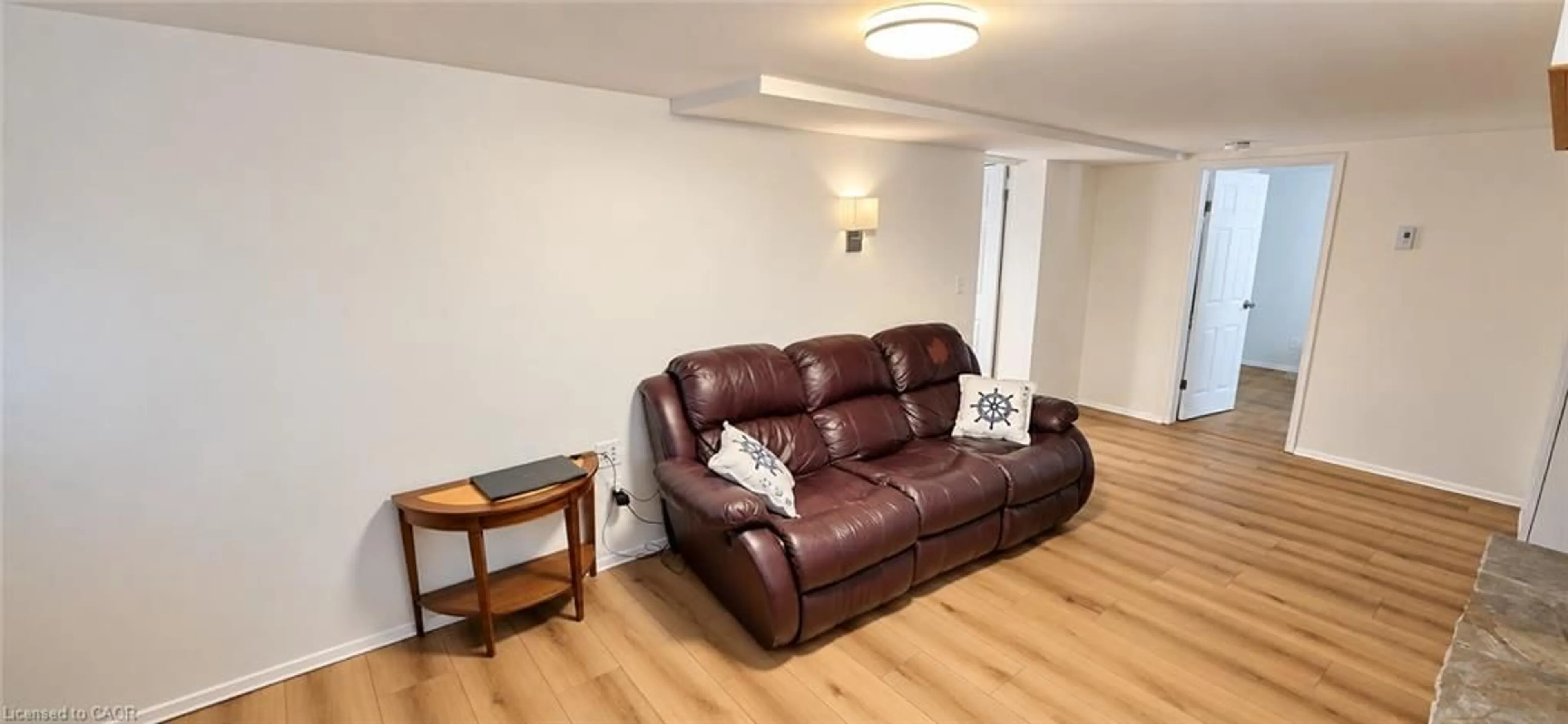 Living room with furniture, wood/laminate floor for 107 Elgin Cres, Waterloo Ontario N2J 2S3