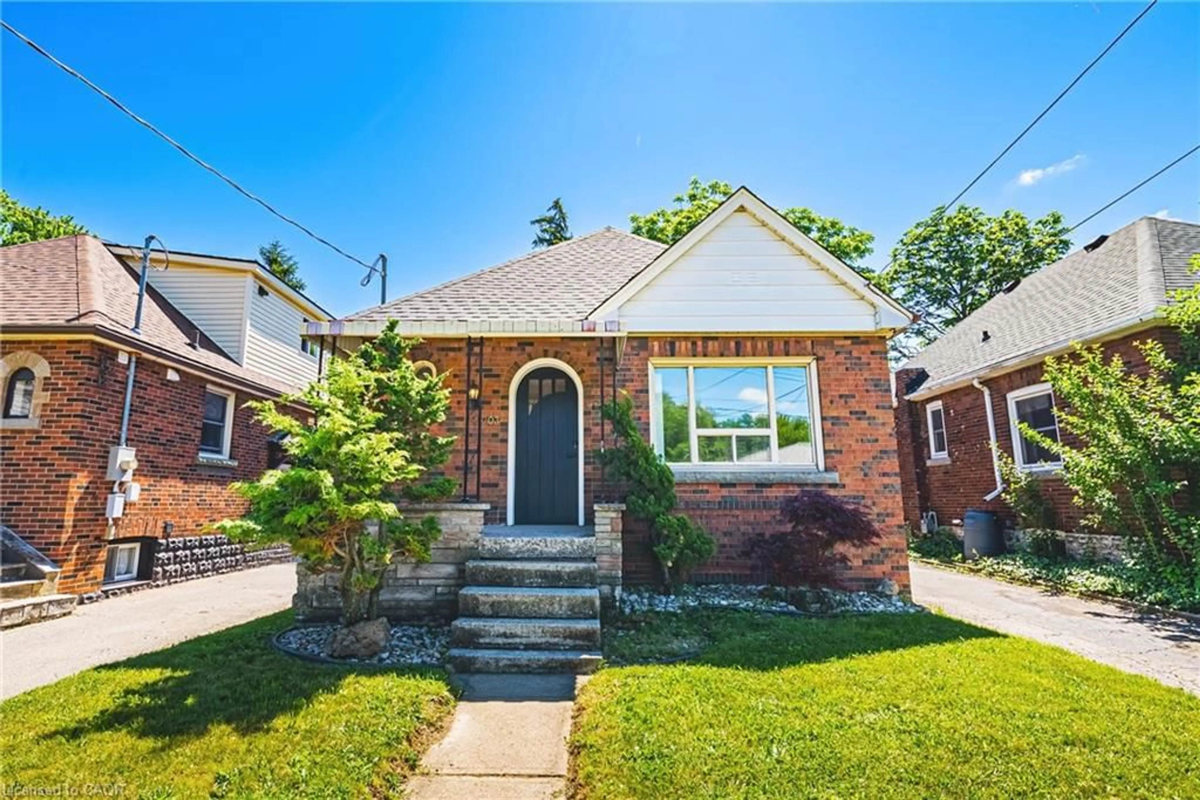 Home with brick exterior material, street for 203 West 2nd St, Hamilton Ontario L9C 3G2