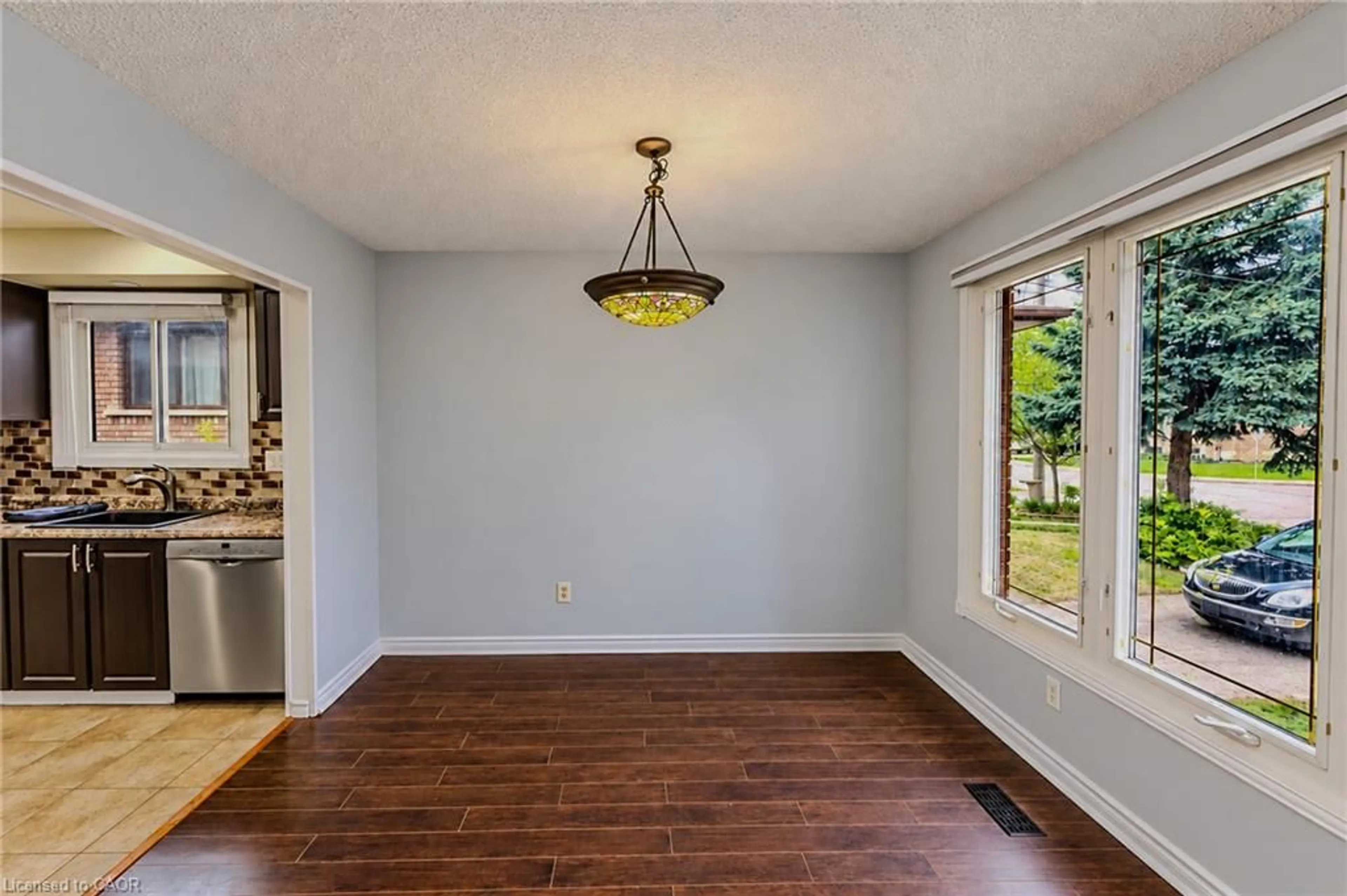 Dining room, wood/laminate floor for 17 Taymall St, Hamilton Ontario L8W 1Z7