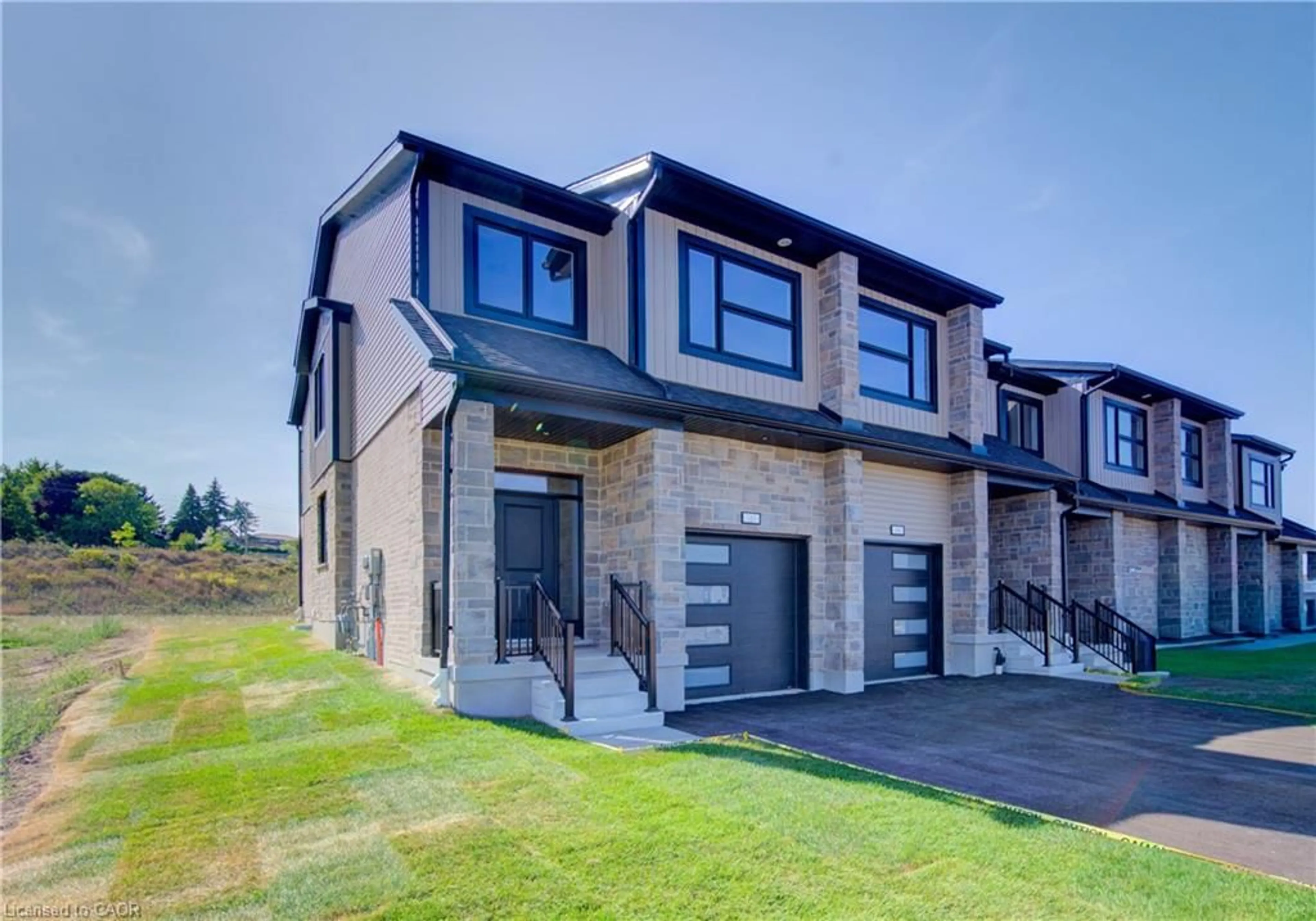 Home with brick exterior material, street for 161 Dunnigan Dr, Kitchener Ontario N2B 0B1