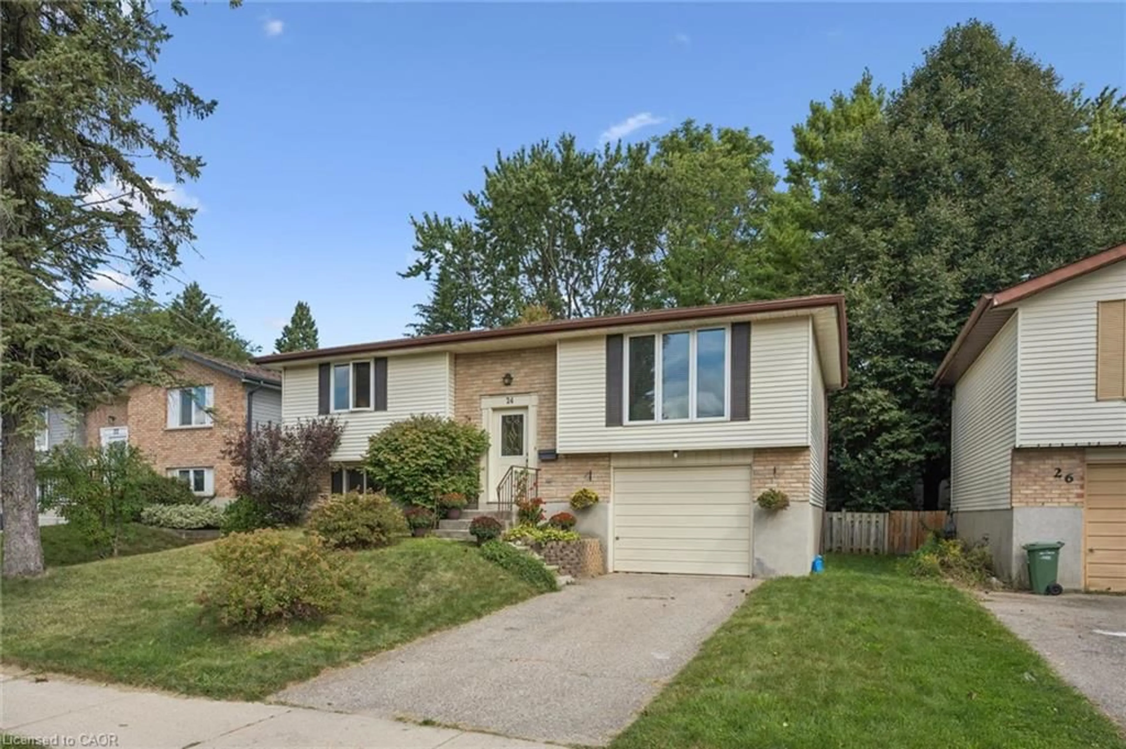 Home with vinyl exterior material, street for 24 Briarlea Rd, Guelph Ontario N1G 3H5