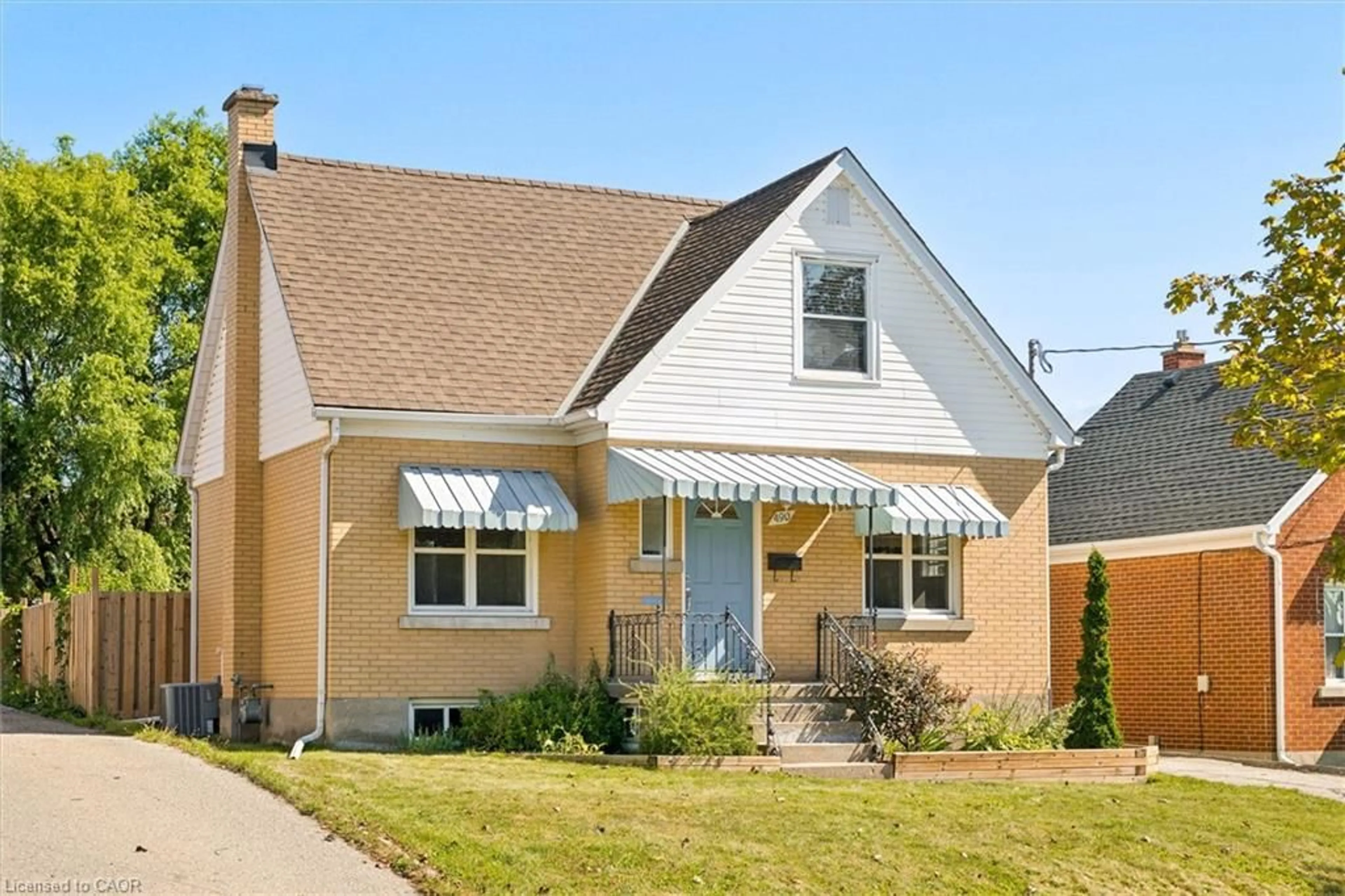 Home with vinyl exterior material, street for 490 East Ave, Kitchener Ontario N2H 1Z8