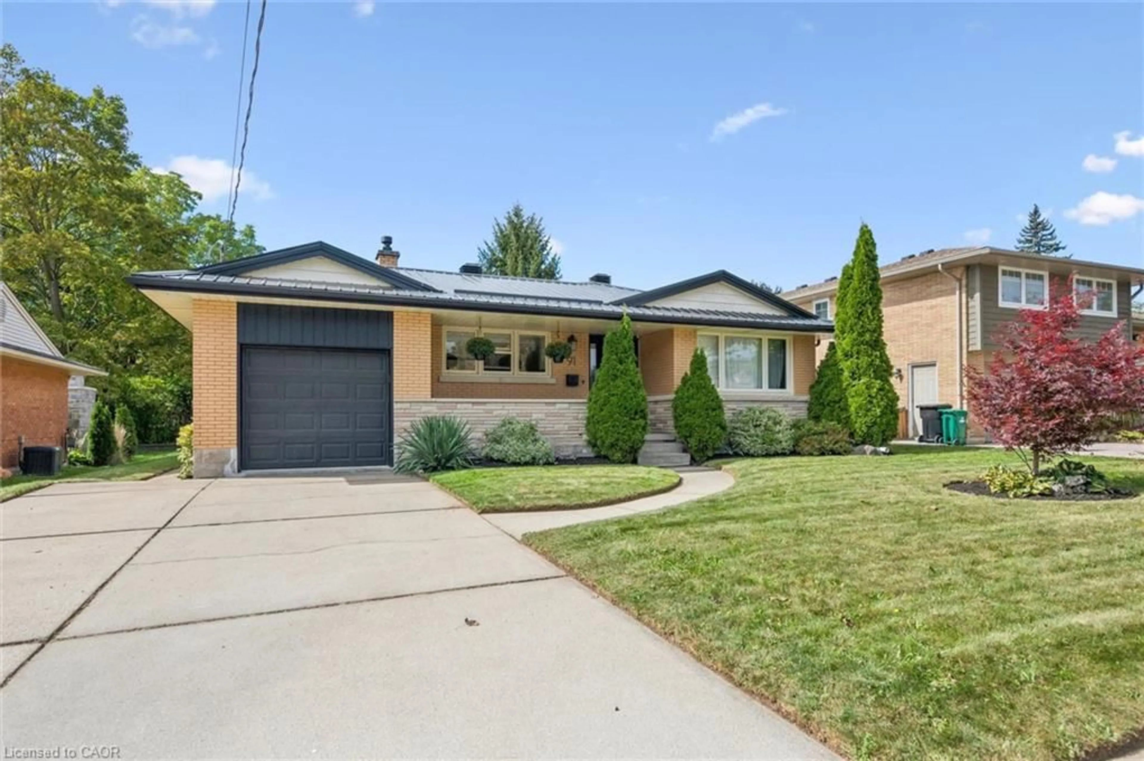 Home with brick exterior material, street for 91 Eton Dr, Kitchener Ontario N2B 1N9