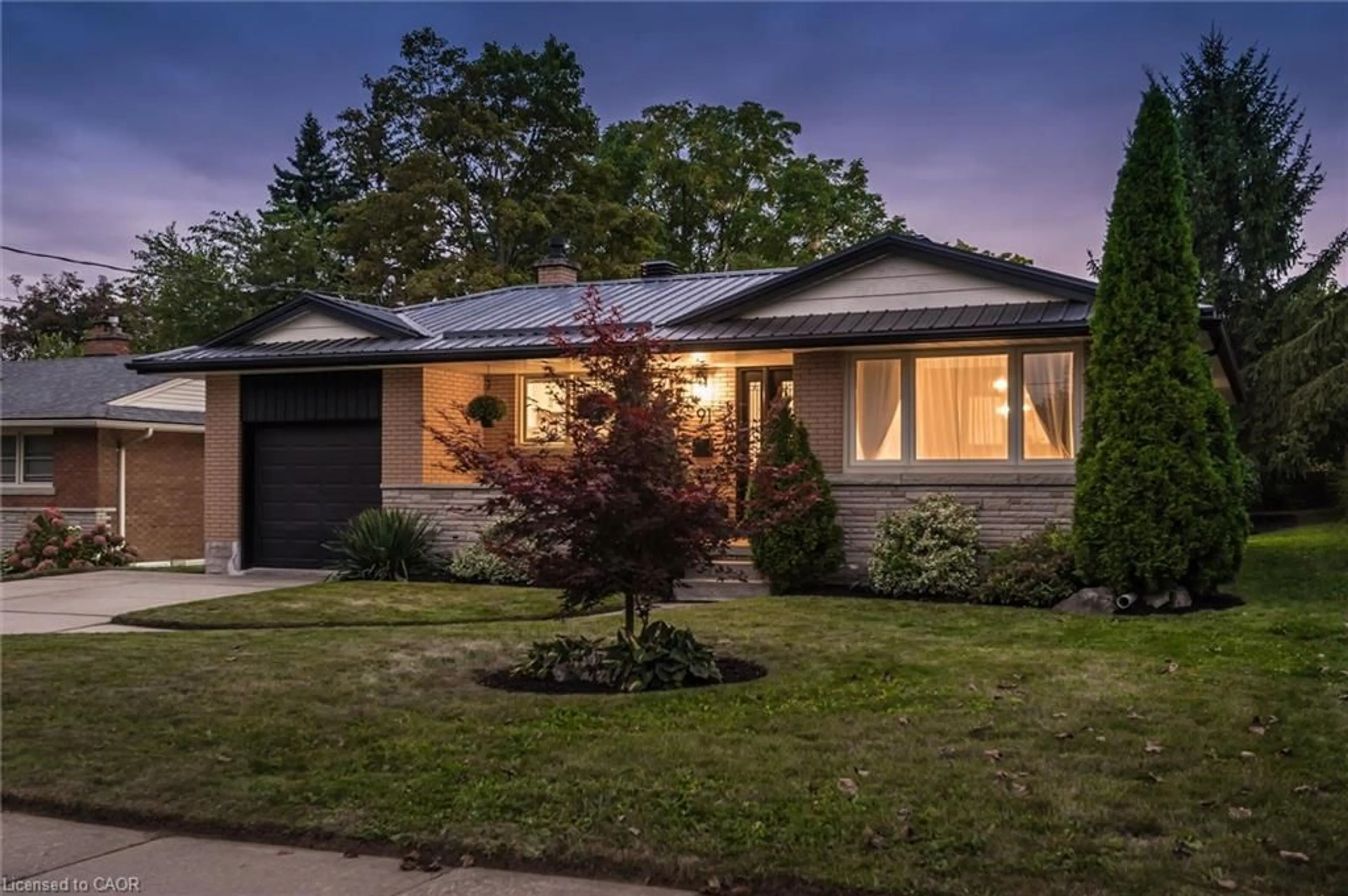 Home with brick exterior material, street for 91 Eton Dr, Kitchener Ontario N2B 1N9