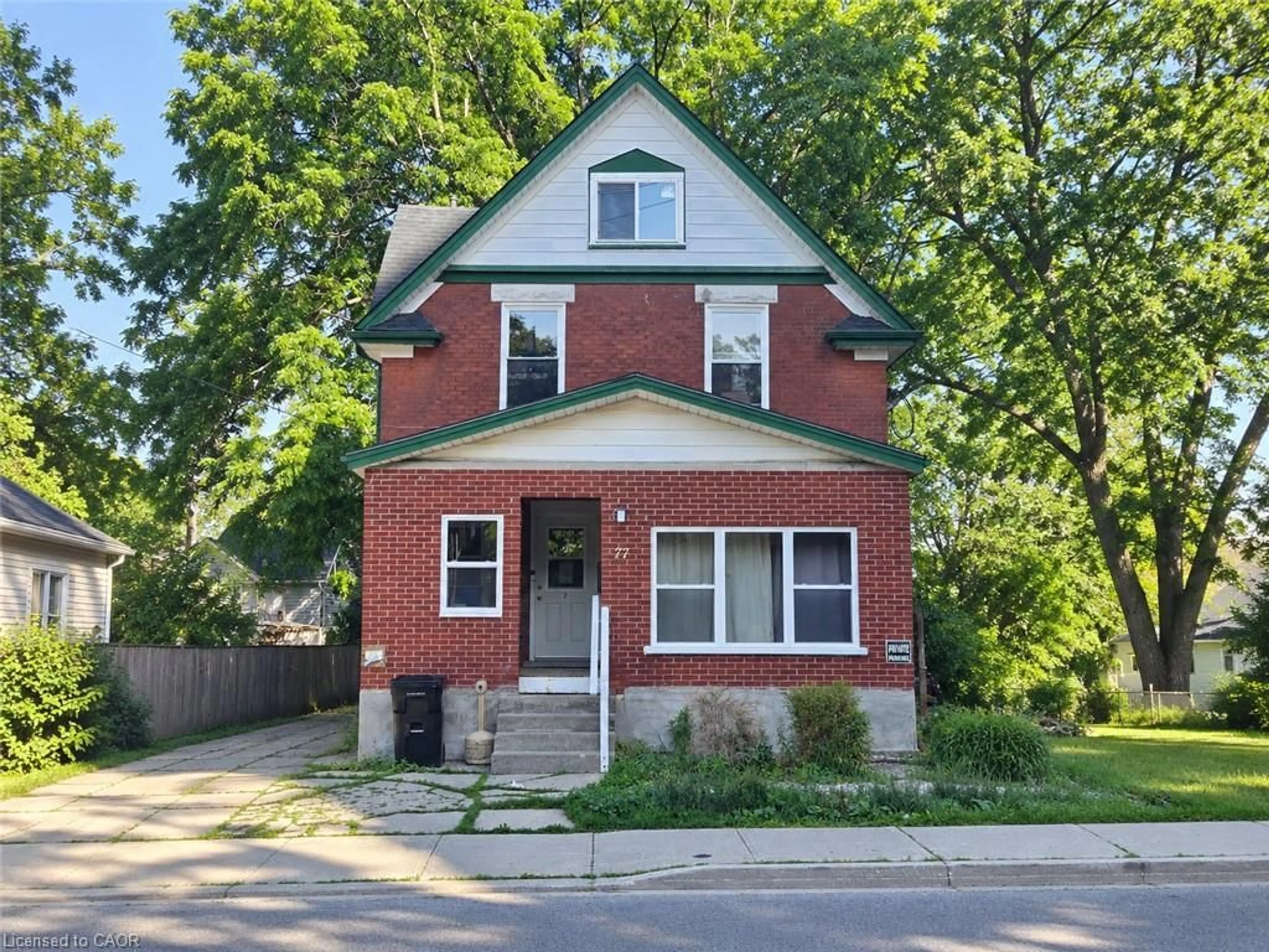 Home with brick exterior material, street for 77 Cedar St, Kitchener Ontario N2G 3L6