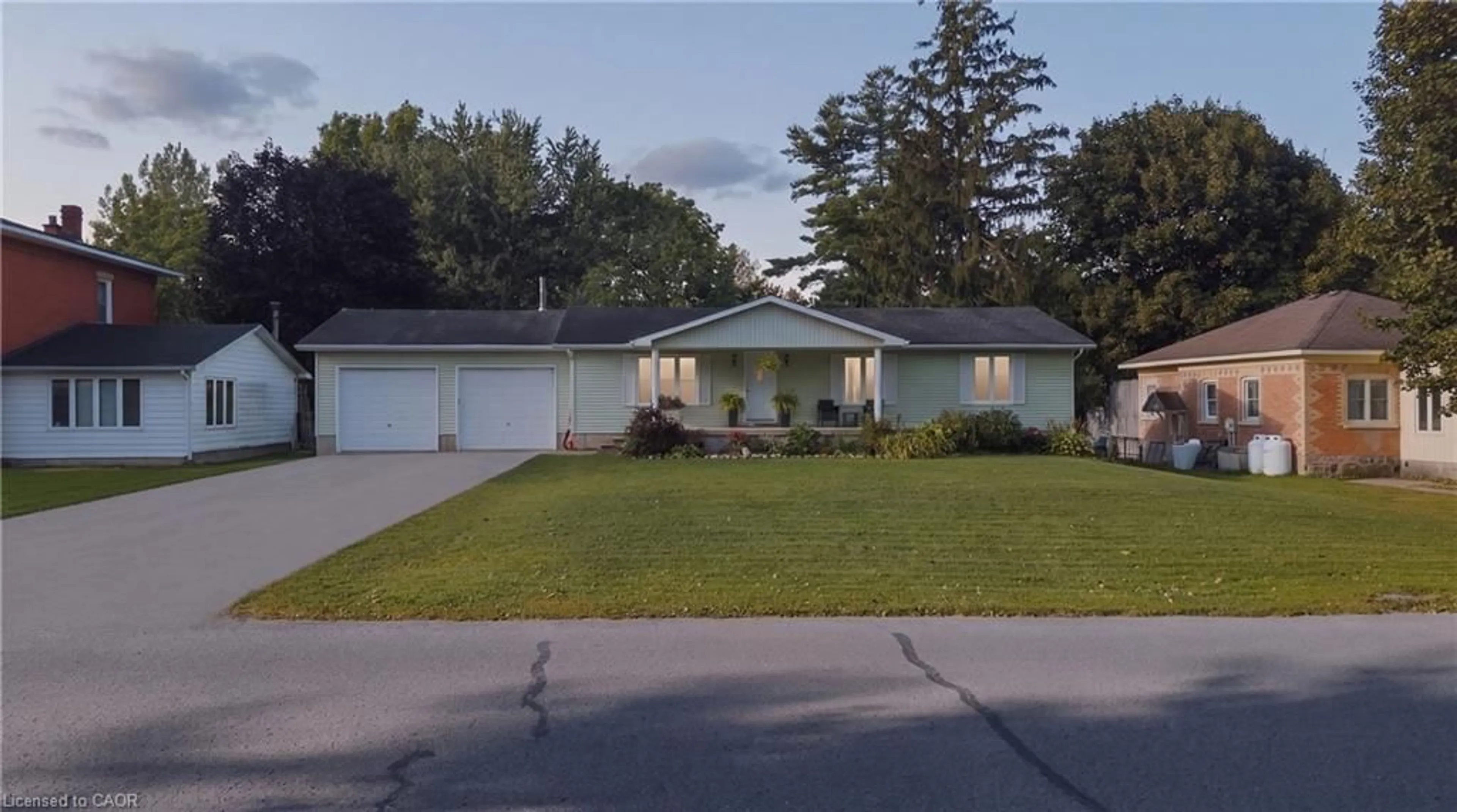 Home with vinyl exterior material, street for 1065 Howick St, Wroxeter Ontario N0G 2X0