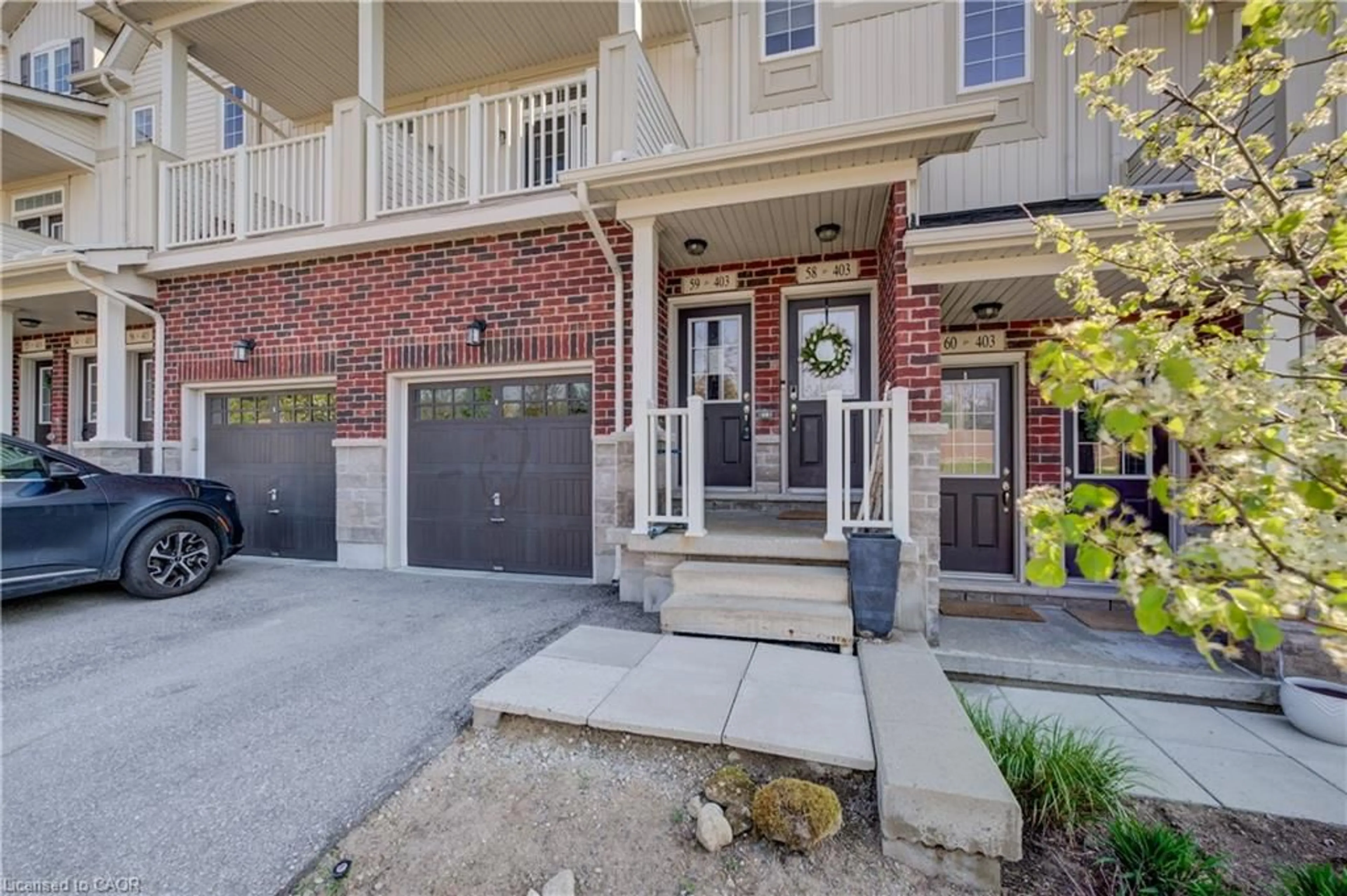 Home with brick exterior material, street for 403 Westwood Dr #59, Kitchener Ontario N2M 0B5