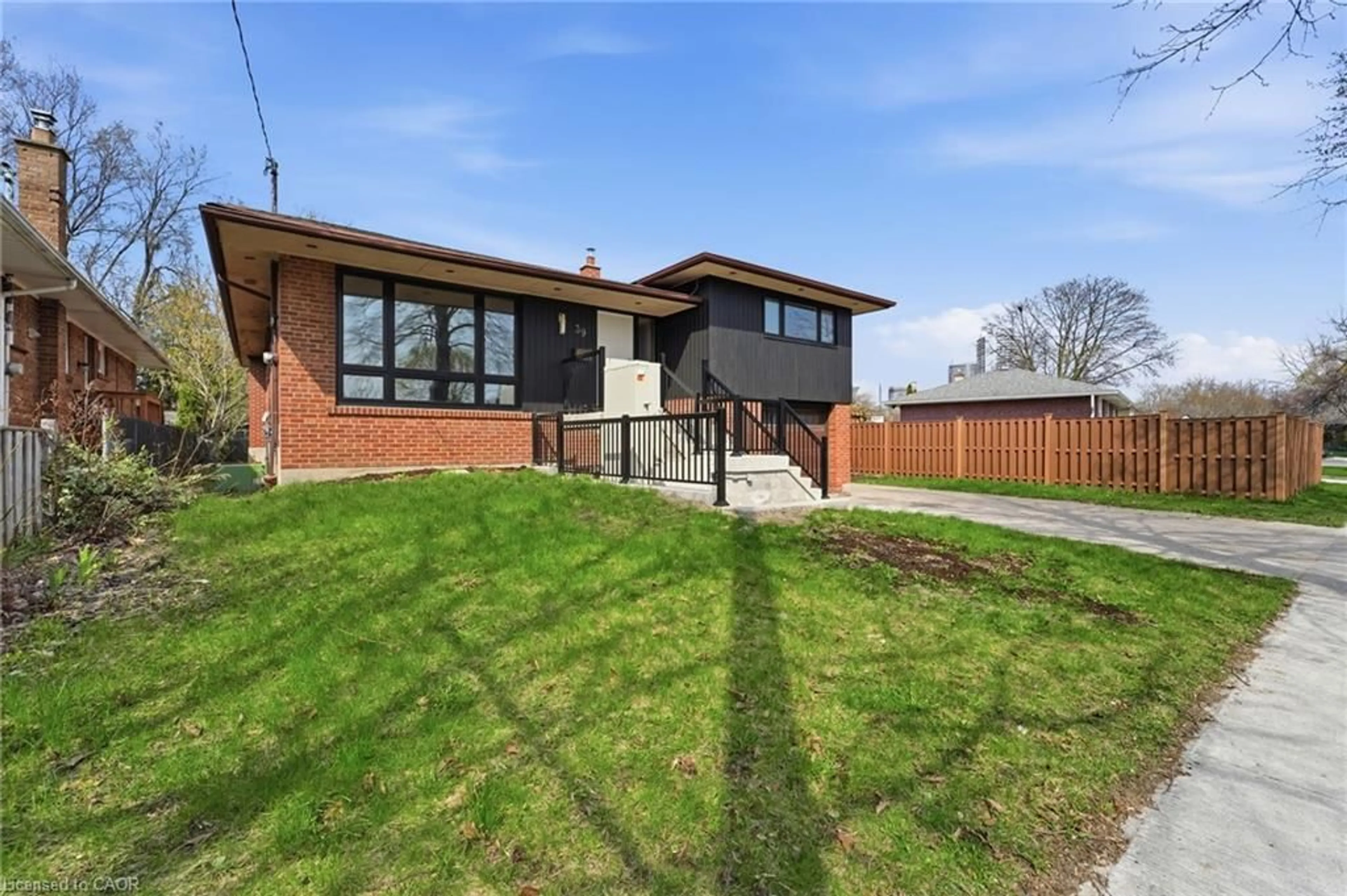 Home with brick exterior material, street for 39 Earlton Rd, Scarborough Ontario M1T 2R4