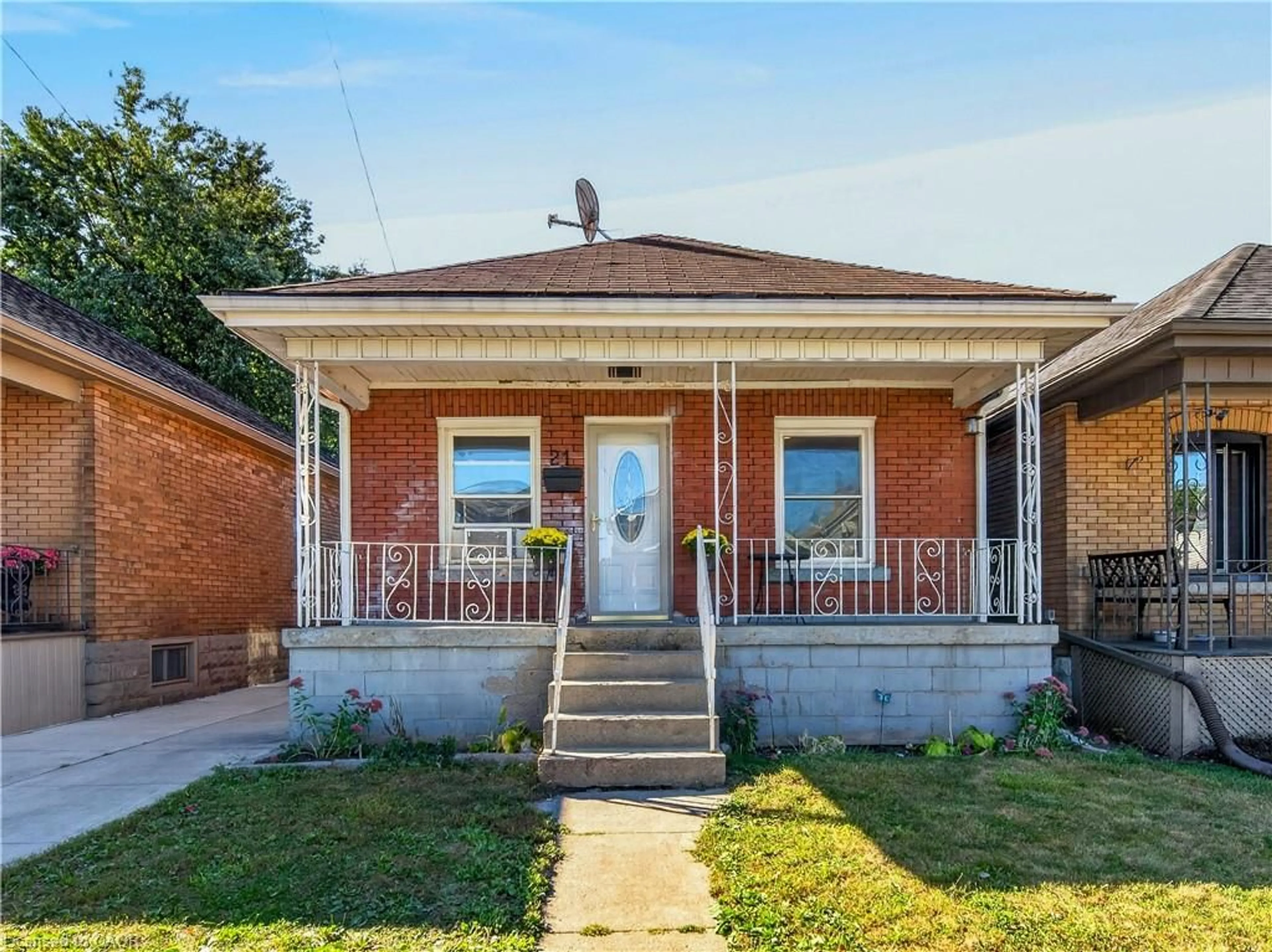 Home with brick exterior material, street for 21 Cameron Ave, Hamilton Ontario L8H 4Y9