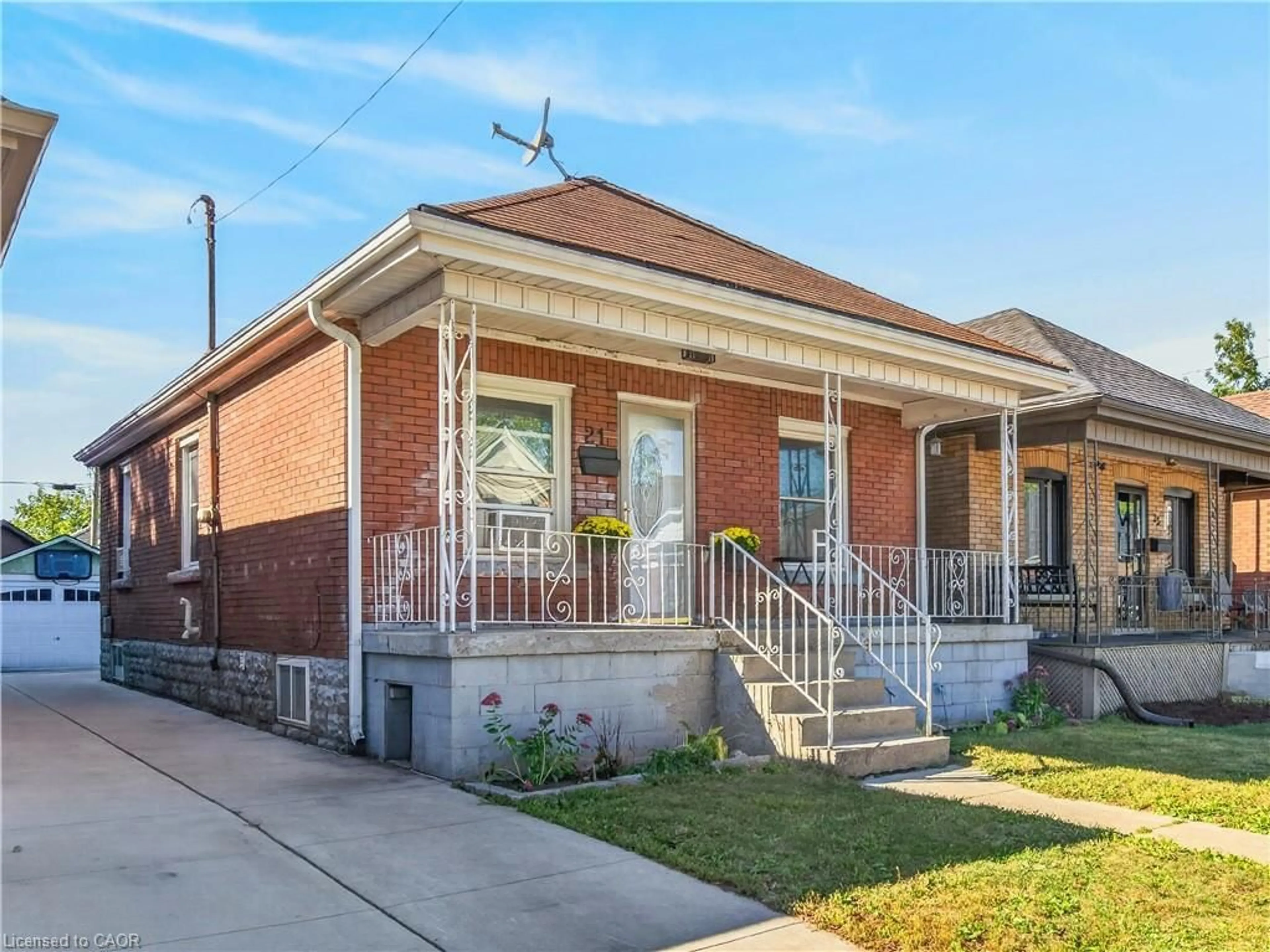 Home with brick exterior material, street for 21 Cameron Ave, Hamilton Ontario L8H 4Y9