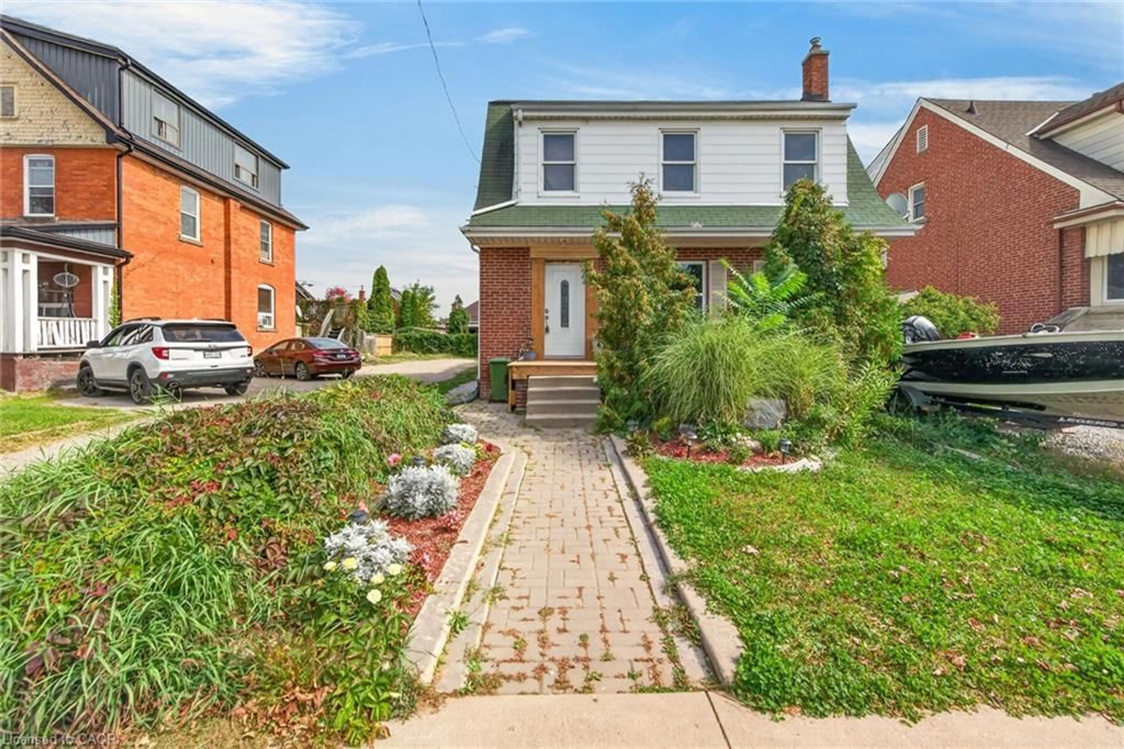 Home with brick exterior material, street for 111 Kenilworth Ave, Hamilton Ontario L8K 2T2