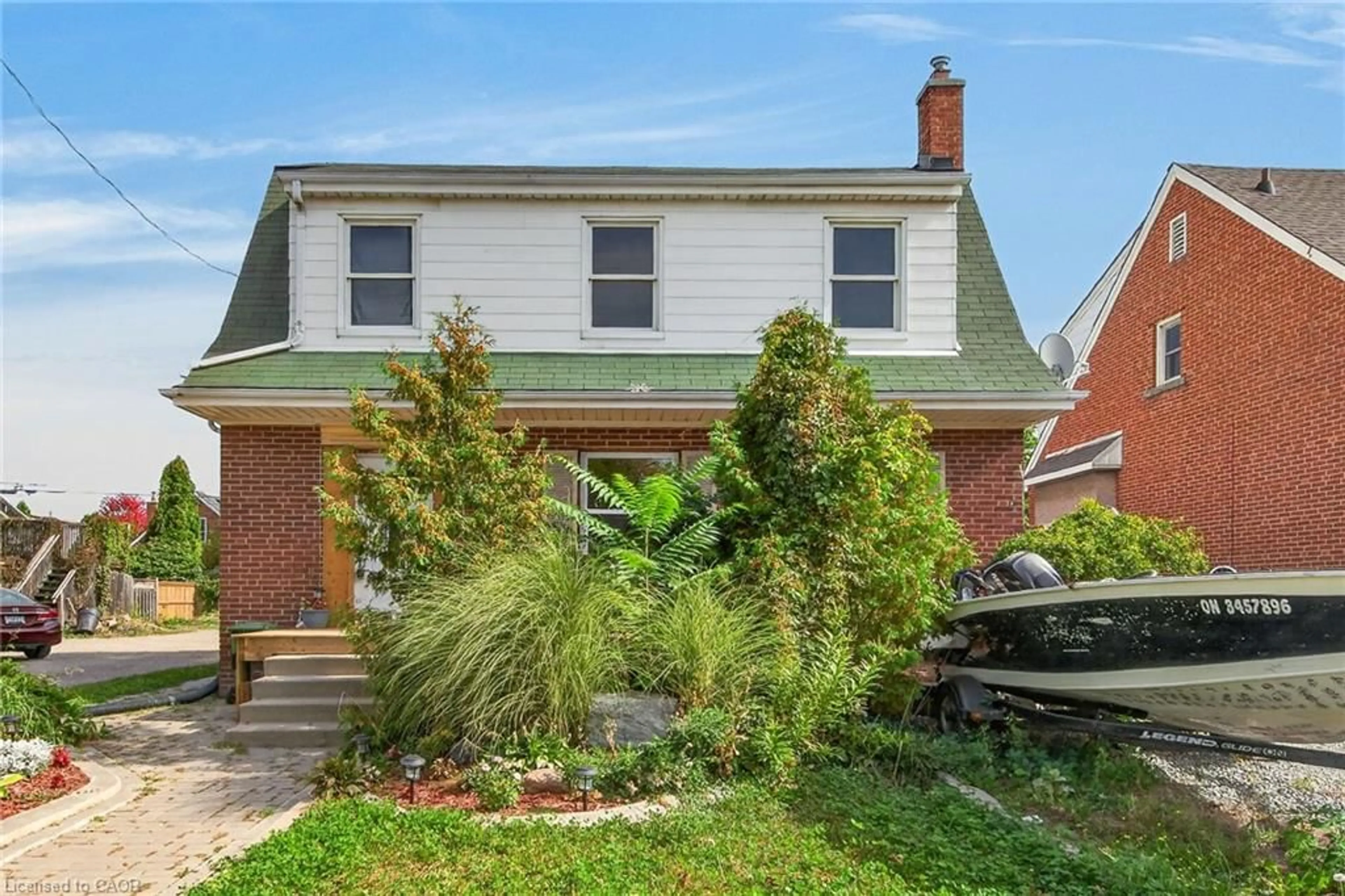 Home with brick exterior material, street for 111 Kenilworth Ave, Hamilton Ontario L8K 2T2