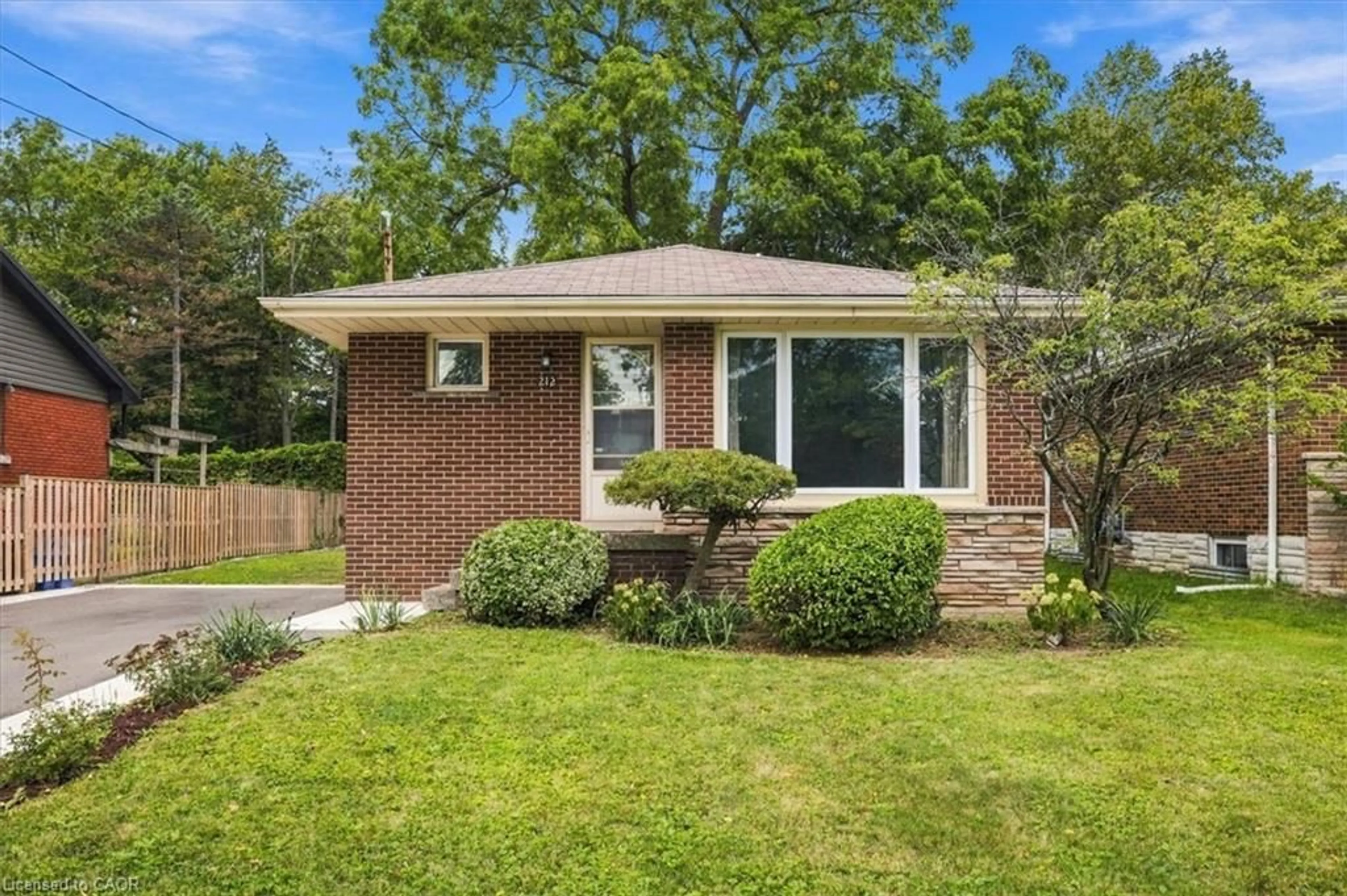 Home with brick exterior material, street for 212 West 33rd St, Hamilton Ontario L9C 5J5