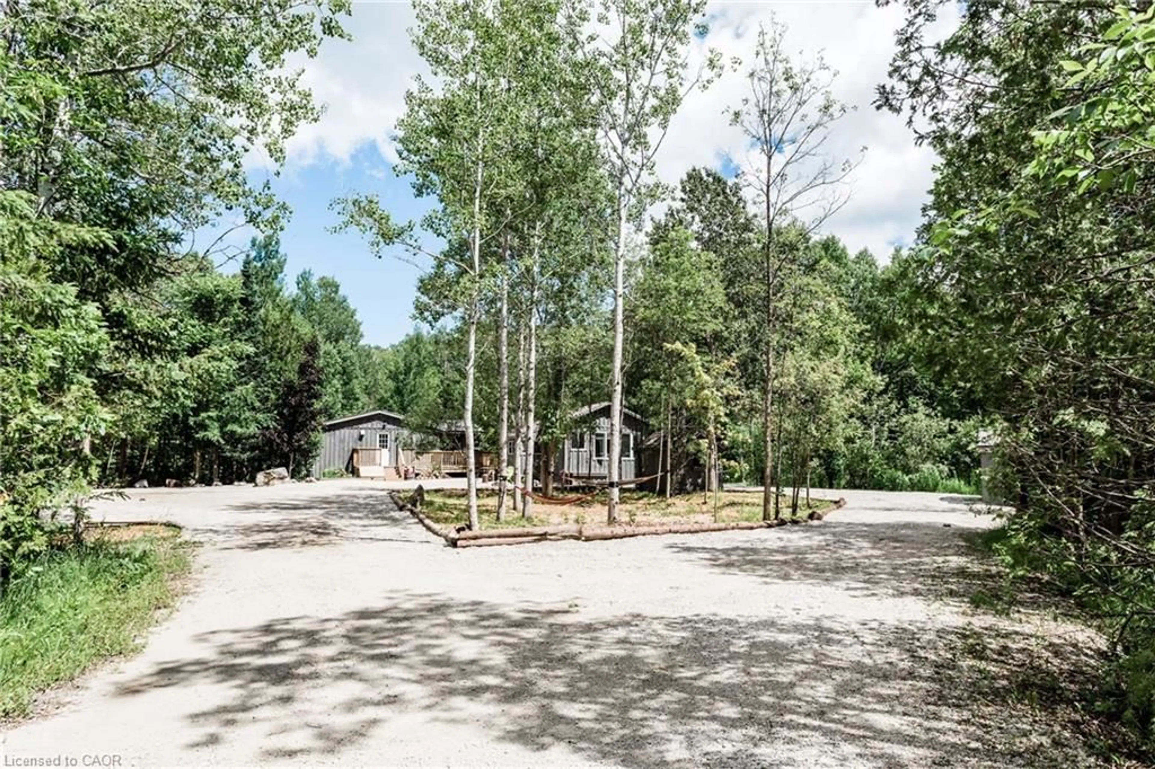 A pic from outside/outdoor area/front of a property/back of a property/a pic from drone, forest/trees view for 102 Cape Chin Rd, Lions Head Ontario N0H 1W0
