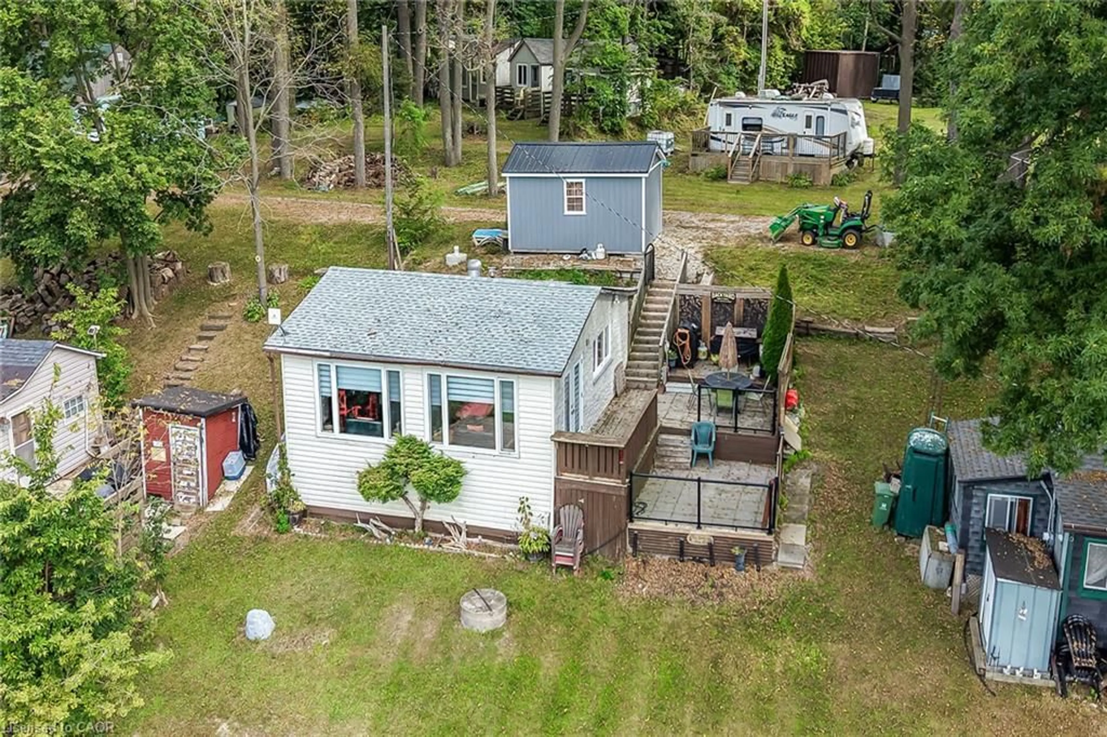 A pic from outside/outdoor area/front of a property/back of a property/a pic from drone, water/lake/river/ocean view for 7 Riverfront Lane, Cayuga Ontario N0A 1E0
