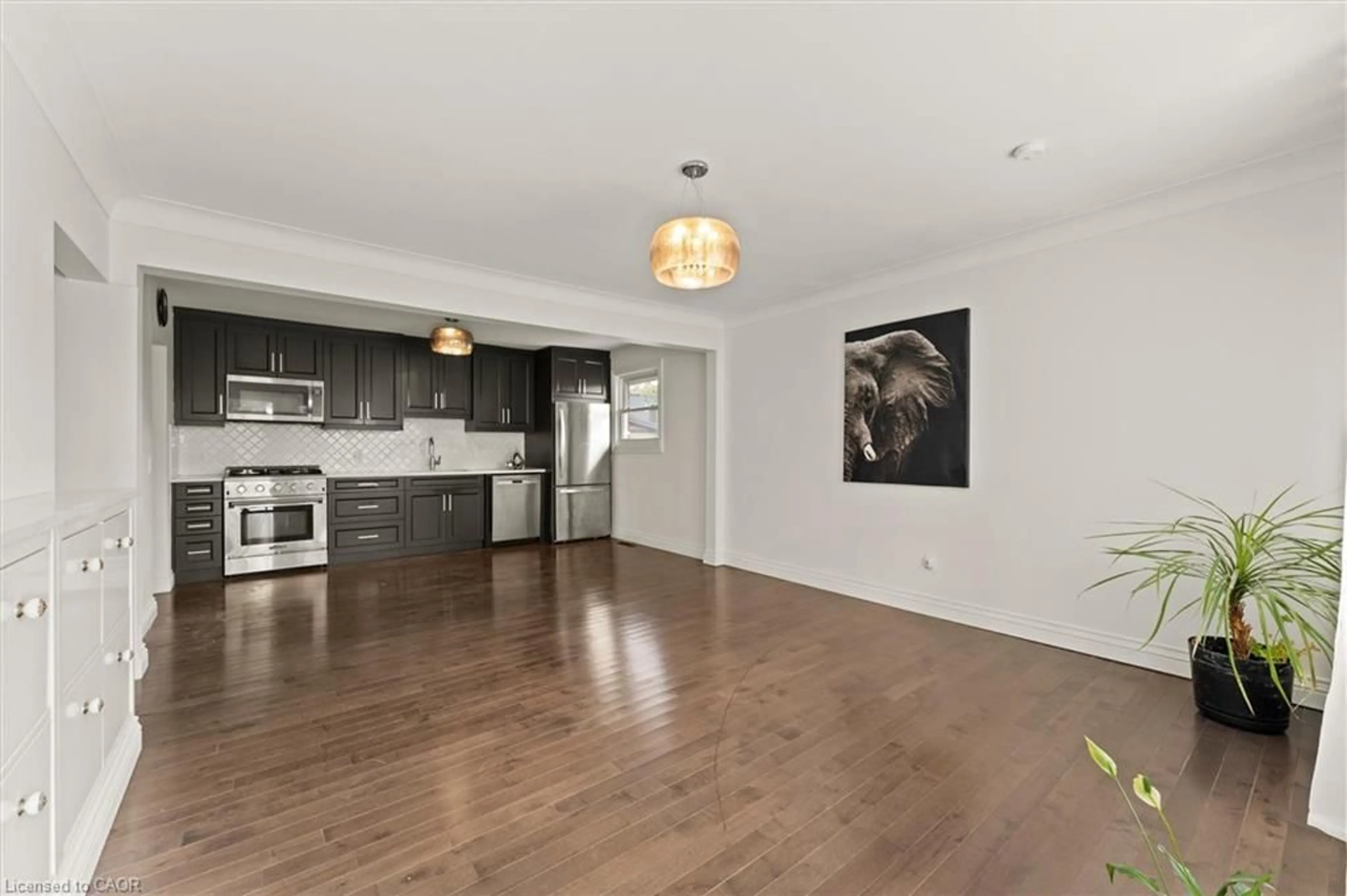 Open concept kitchen, wood/laminate floor for 85 Riverview Ave, LaSalle Ontario N9J 1Z9