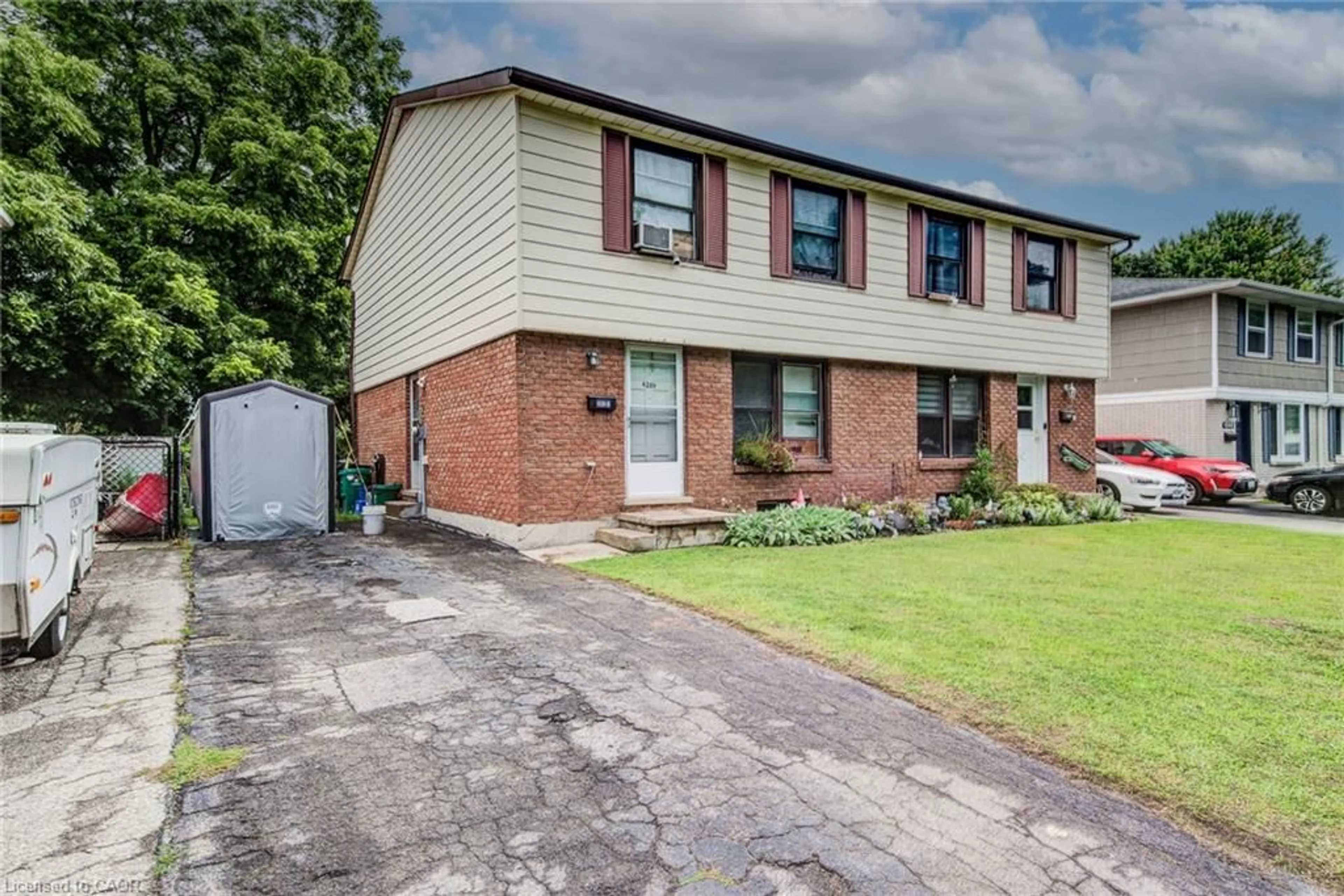 Home with brick exterior material, street for 428B Dunvegan Dr, Waterloo Ontario N2K 2C7