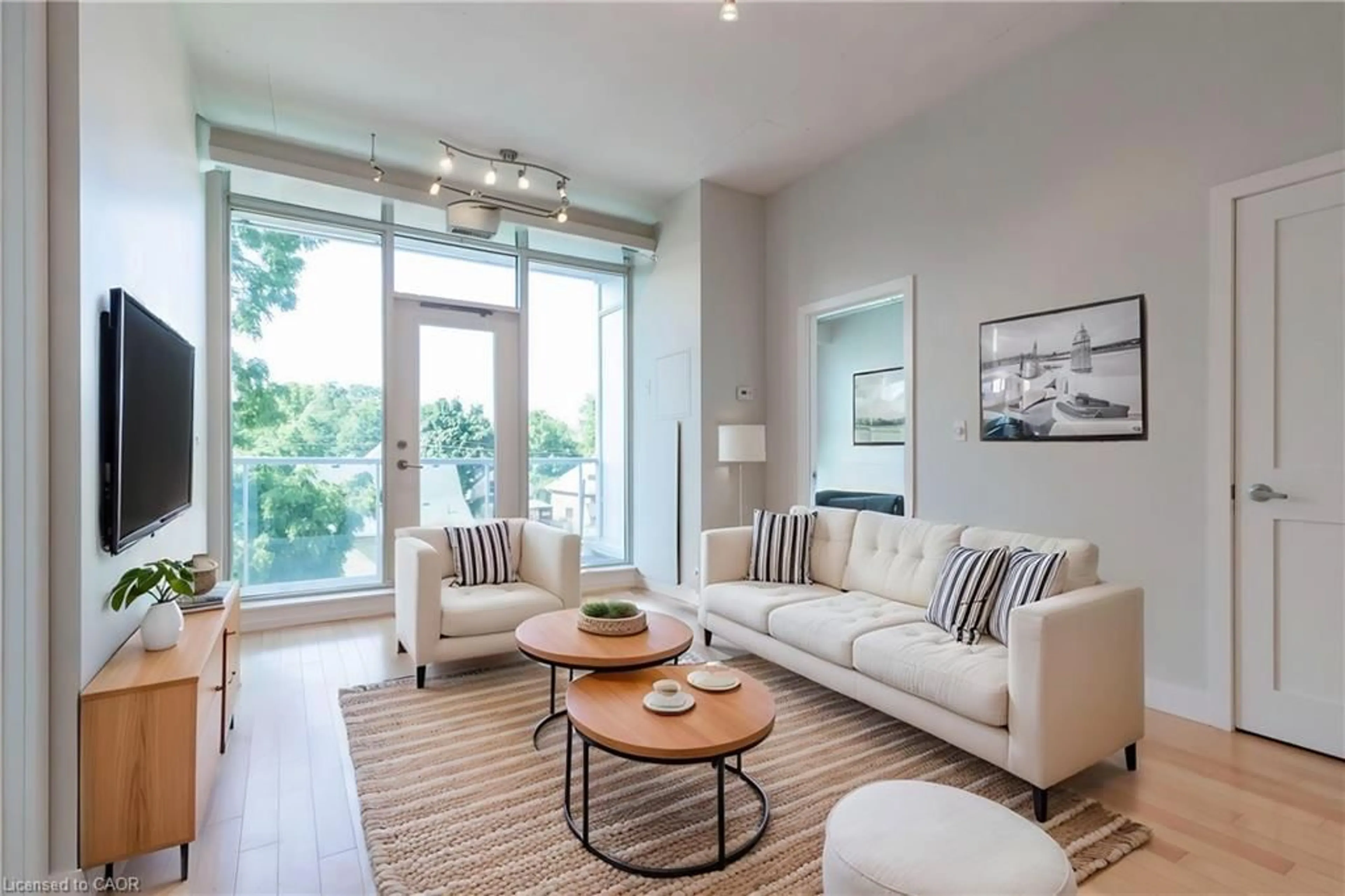 Living room with furniture, unknown for 42 Bridgeport Rd #301, Waterloo Ontario N2J 0B3