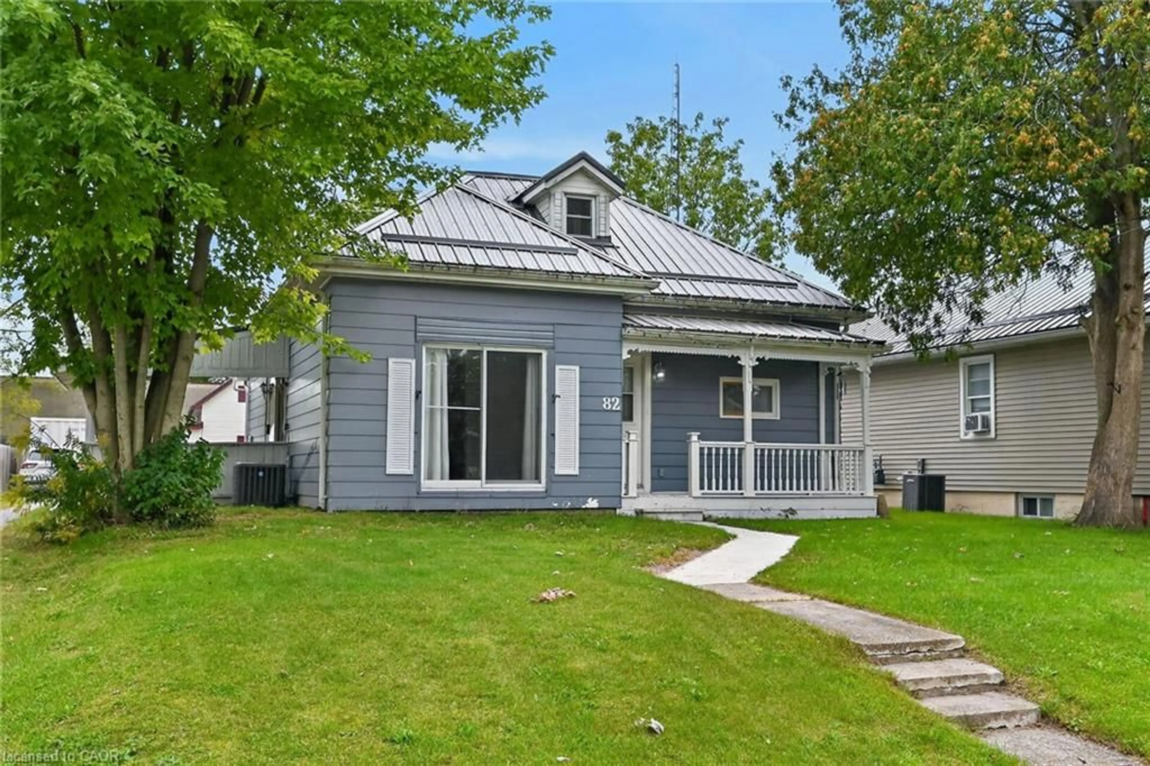 Home with vinyl exterior material, street for 80-82 Ann St, Delhi Ontario N4B 1H5