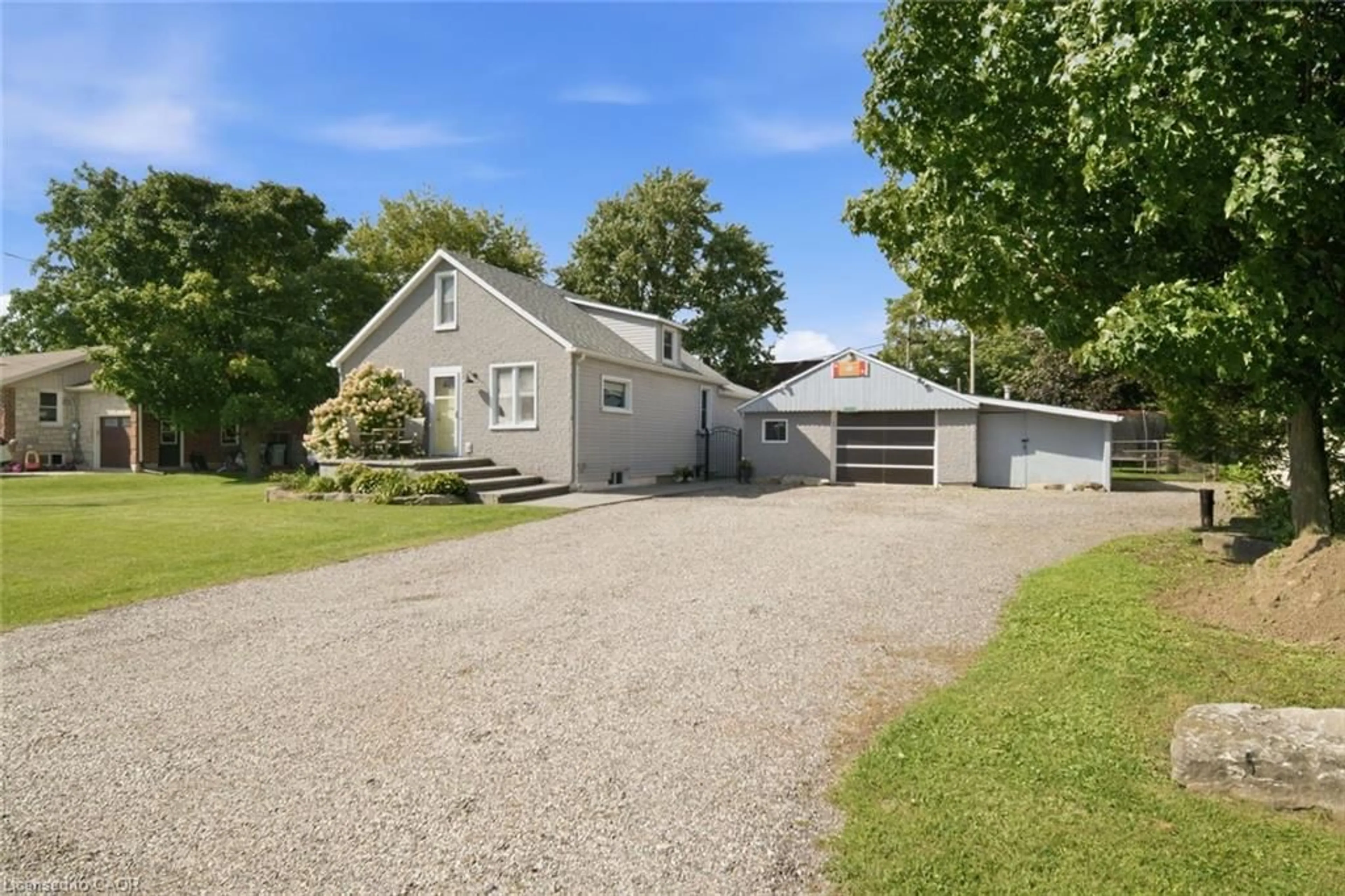 A pic from outside/outdoor area/front of a property/back of a property/a pic from drone, street for 2214 William Shakespeare St, Shakespeare Ontario N0B 2P0