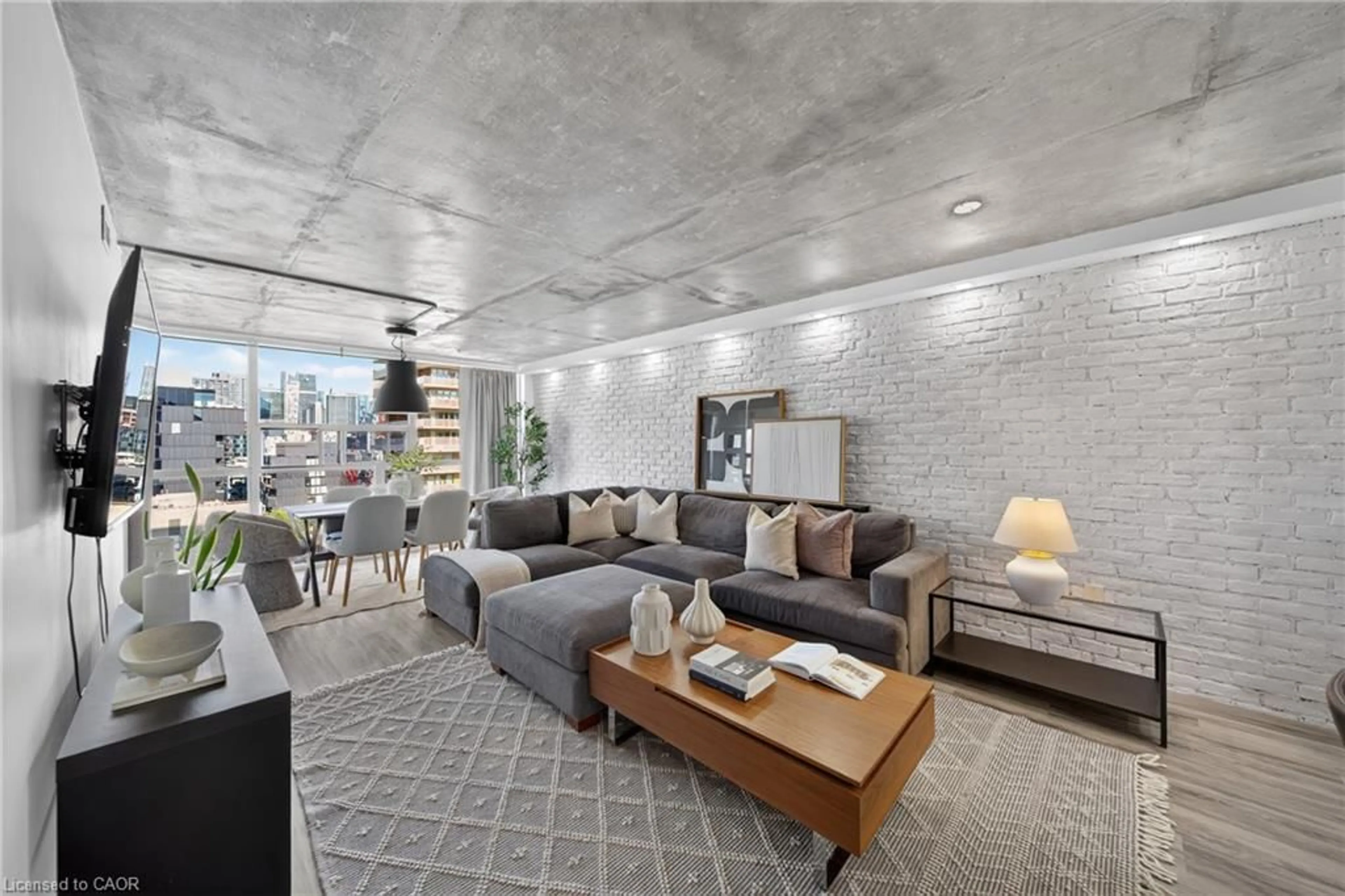 Living room with furniture, cement floor for 705 King St #1603, Toronto Ontario M5V 2W8