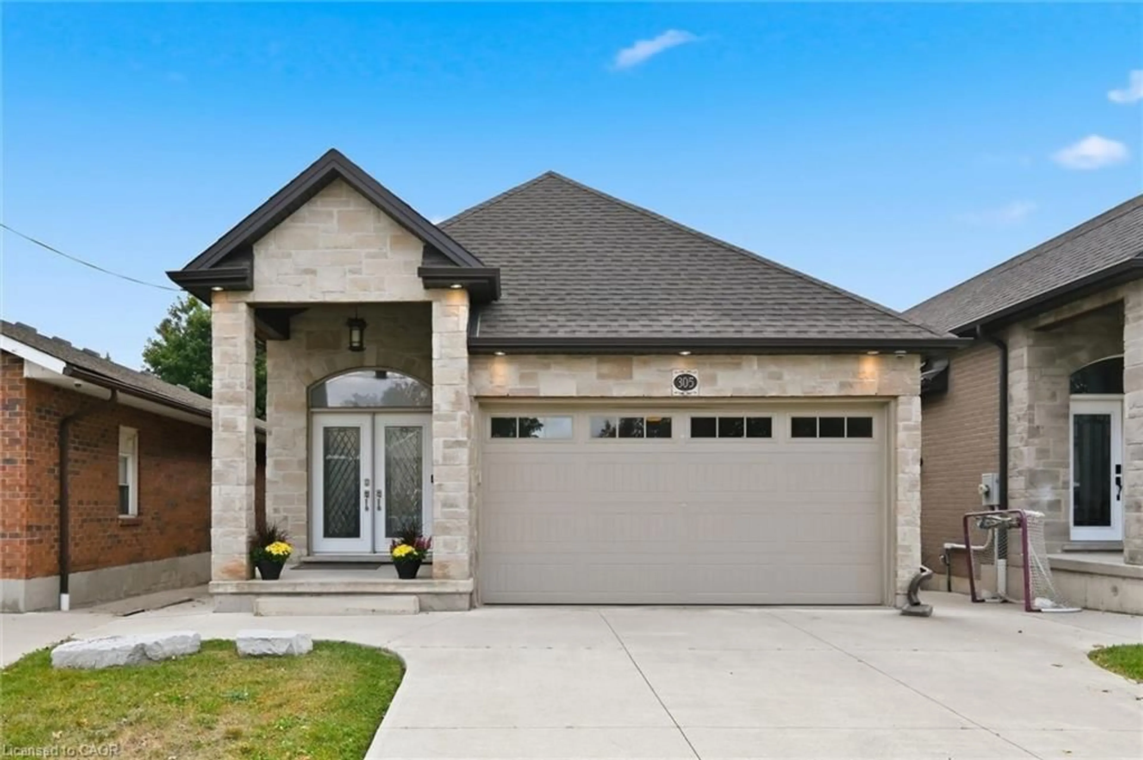 Home with brick exterior material, street for 305 Caledon Ave, Hamilton Ontario L9C 3C9