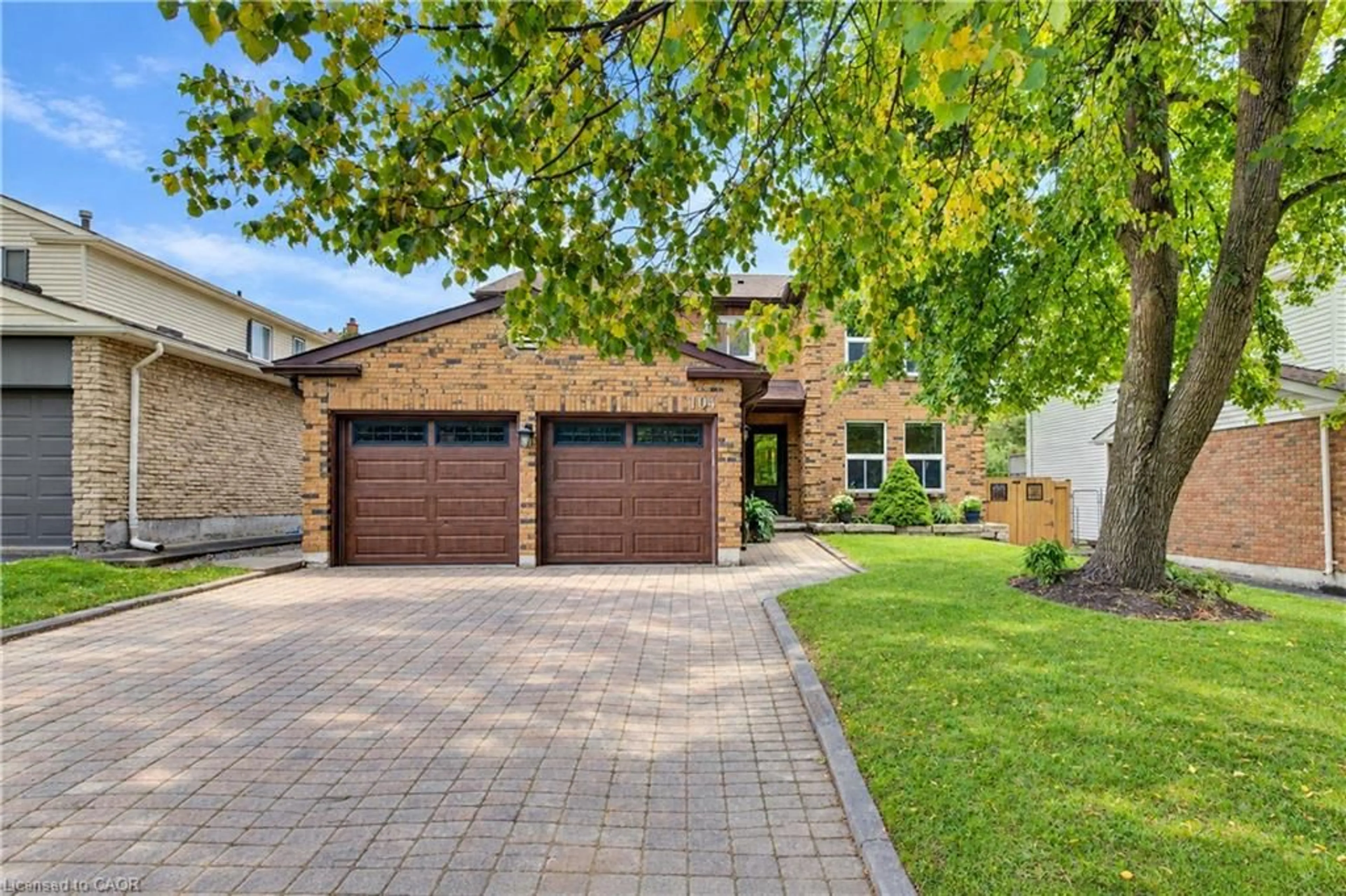 Home with brick exterior material, street for 104 Deerwood Cres, Kitchener Ontario N2N 1R3