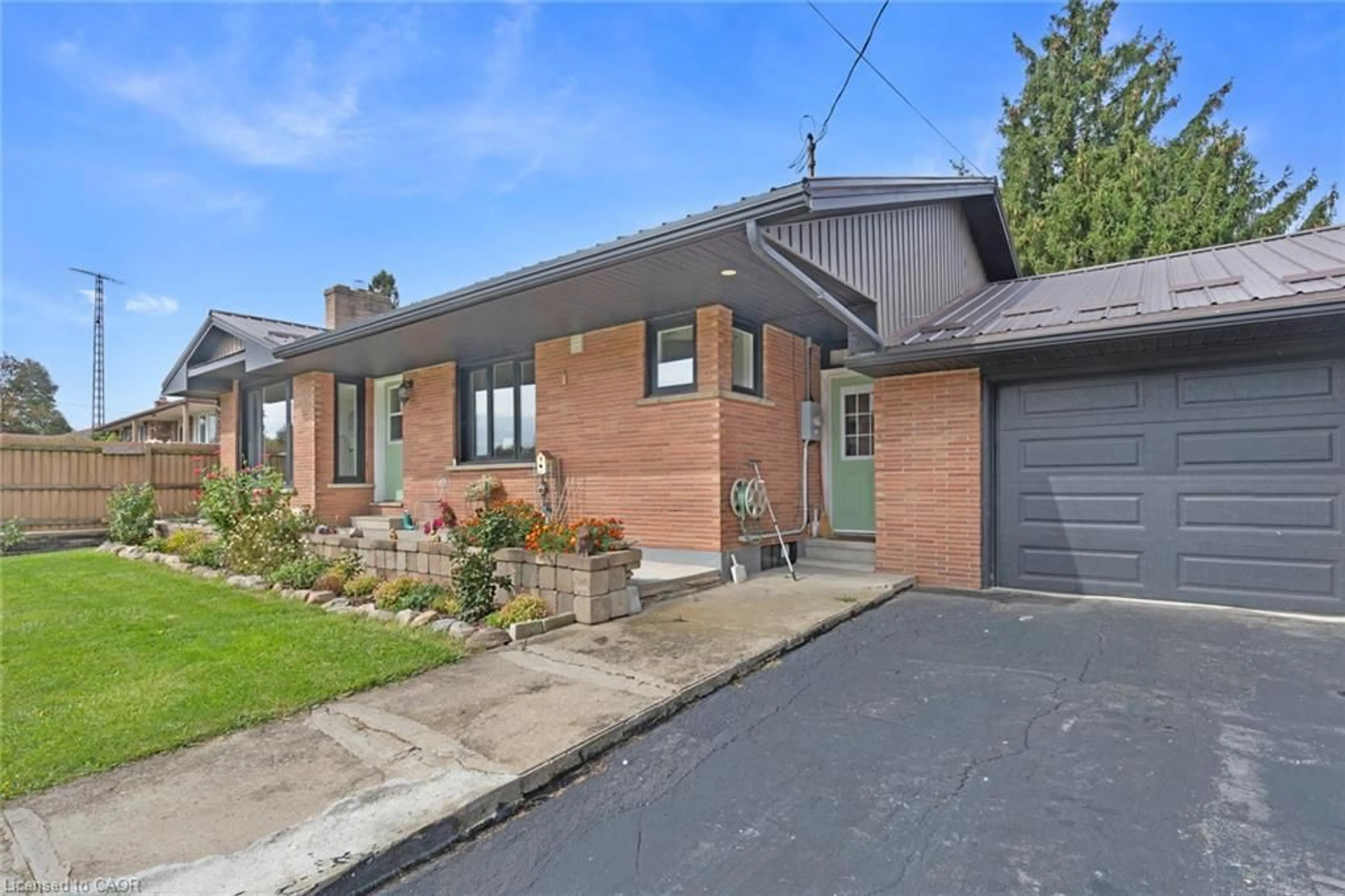 Home with brick exterior material, street for 24 Alpha St, Delhi Ontario N4B 1B2