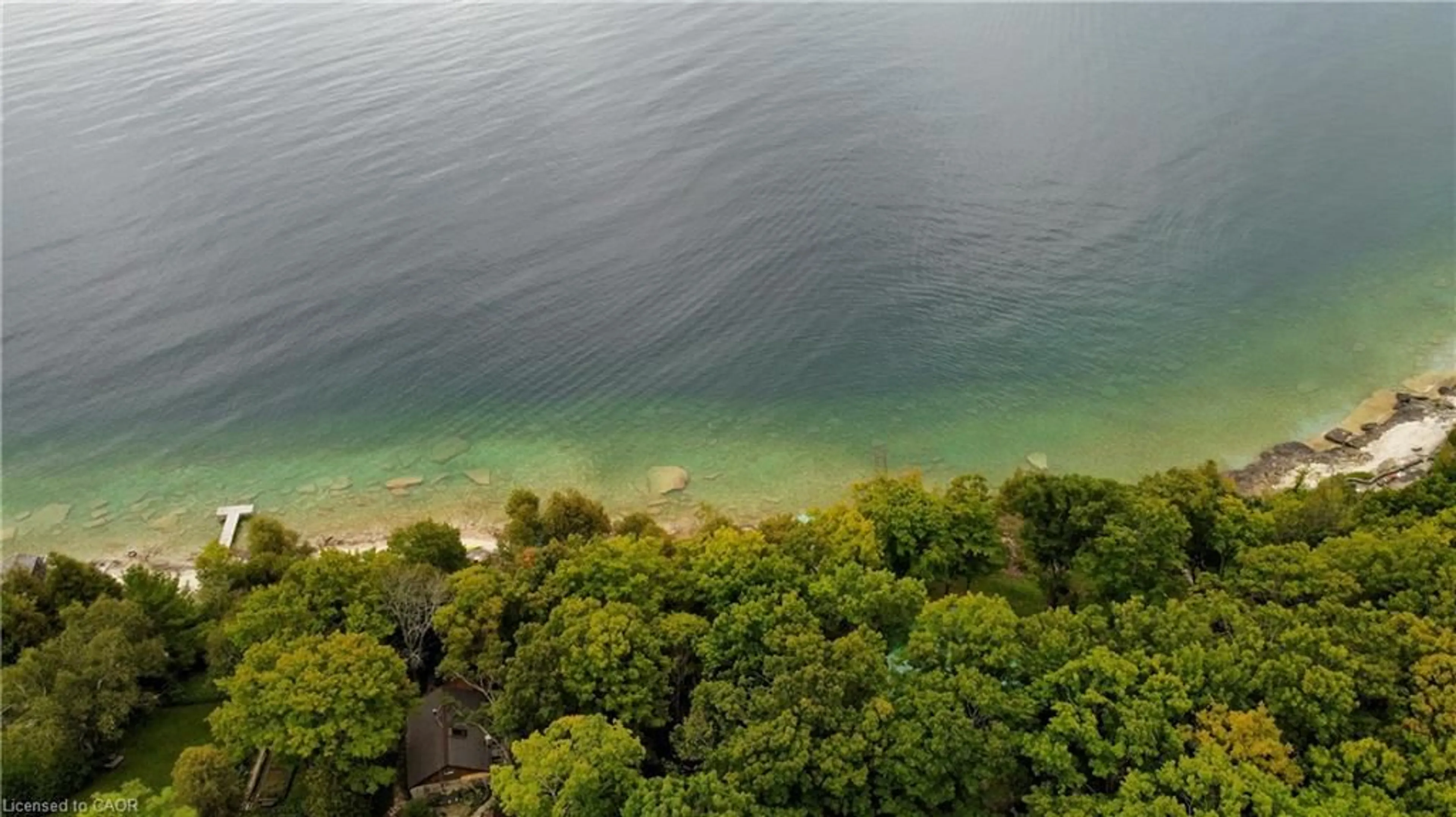 A pic from outside/outdoor area/front of a property/back of a property/a pic from drone, water/lake/river/ocean view for 38 Whippoorwill Rd, Lions Head Ontario N0H 1W0