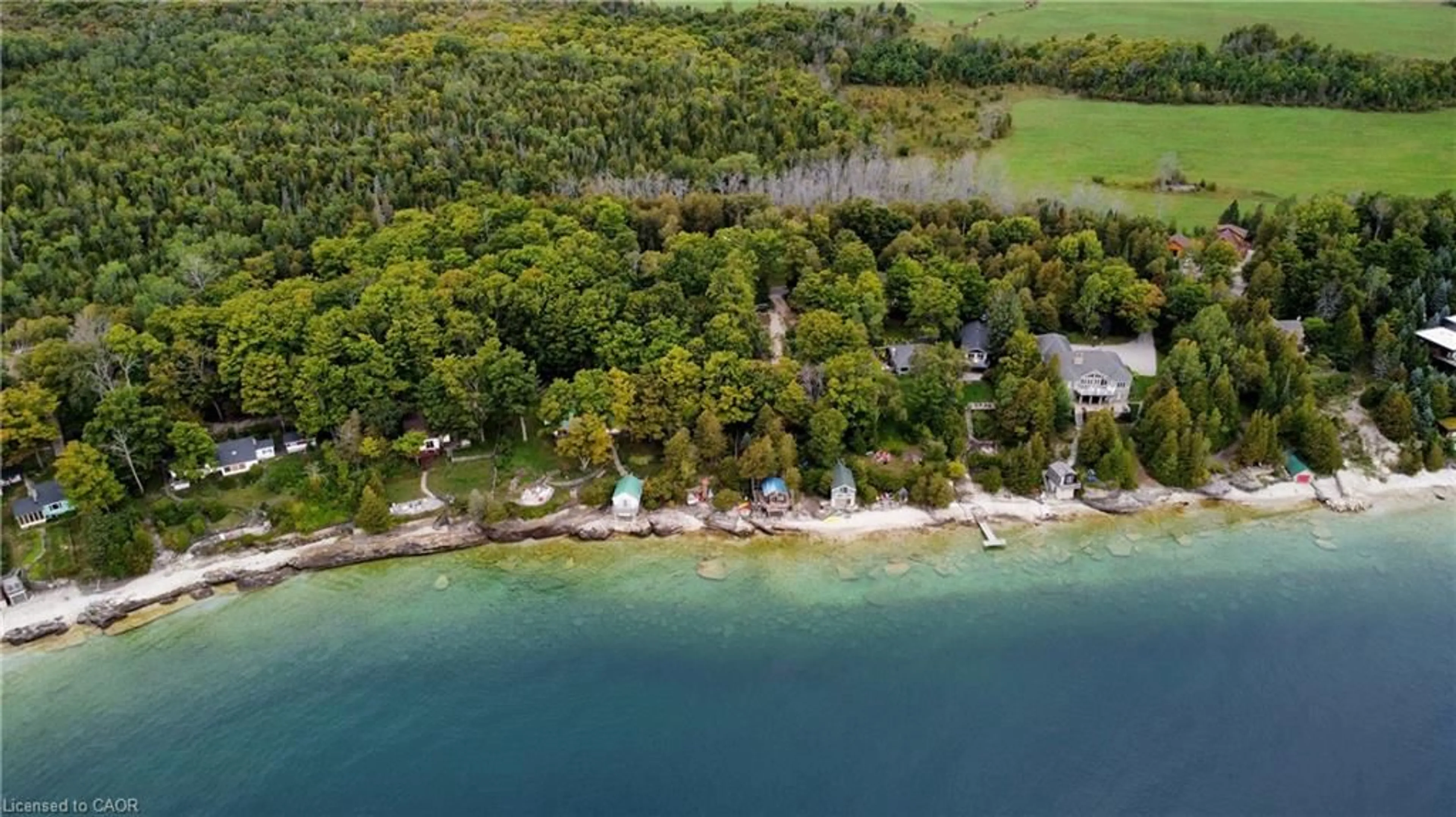 A pic from outside/outdoor area/front of a property/back of a property/a pic from drone, water/lake/river/ocean view for 38 Whippoorwill Rd, Lions Head Ontario N0H 1W0