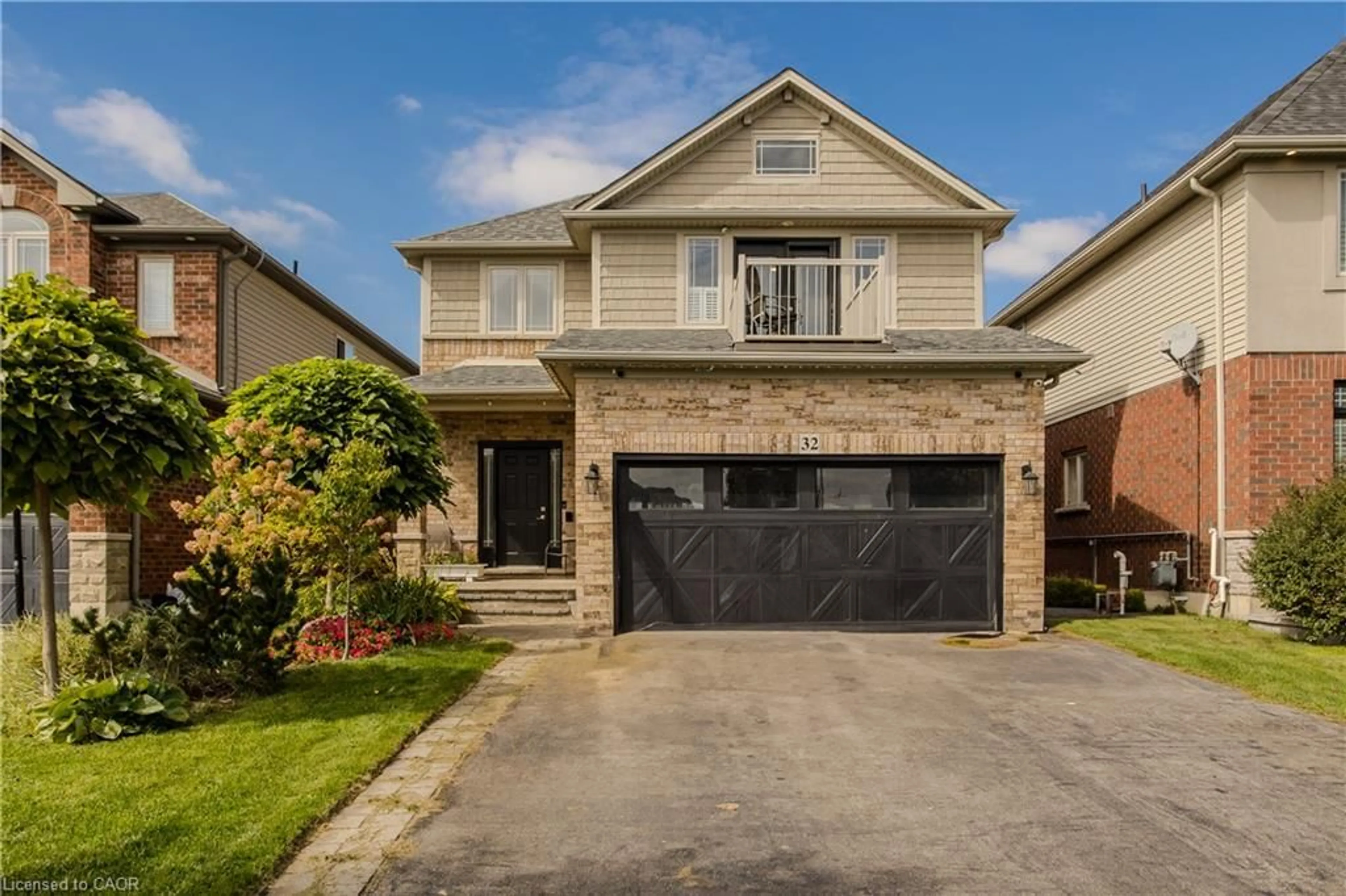 Home with brick exterior material, street for 32 Great Oak Trail, Binbrook Ontario L0R 1C0