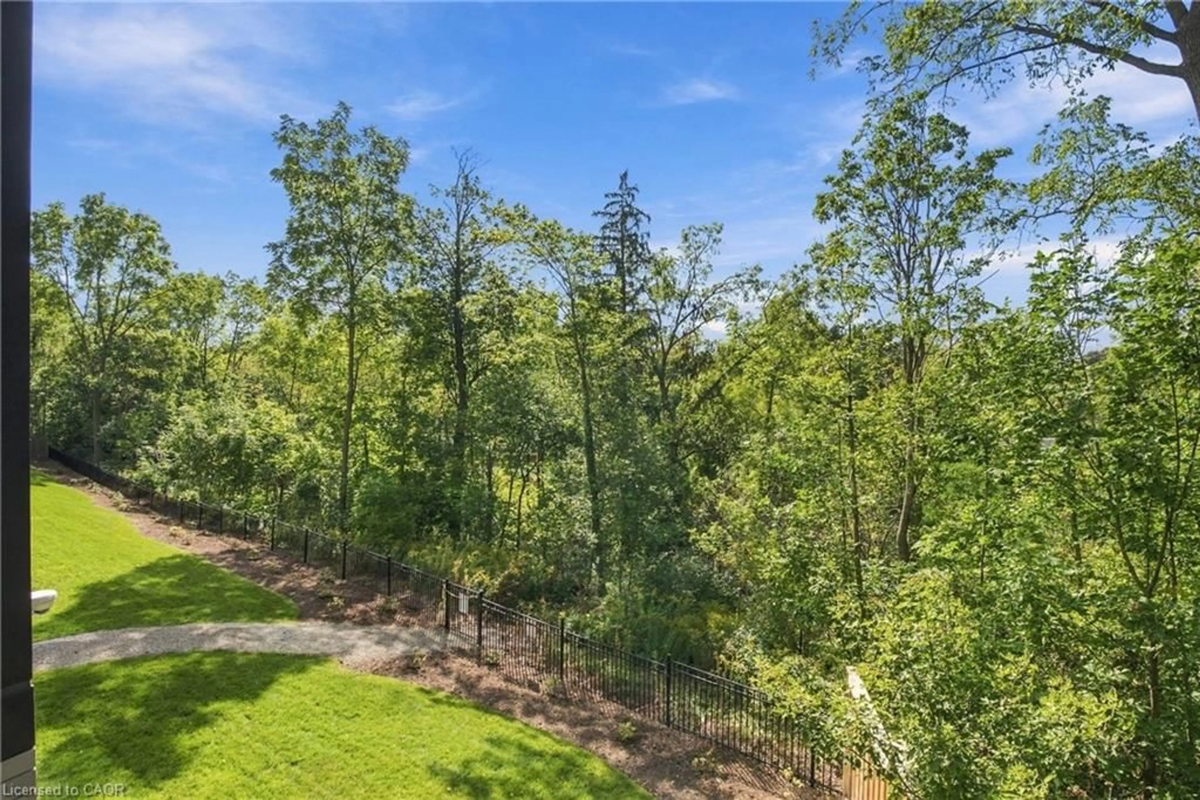 A pic from outside/outdoor area/front of a property/back of a property/a pic from drone, forest/trees view for 77 Yates St #201, St. Catharines Ontario L2R 5R7