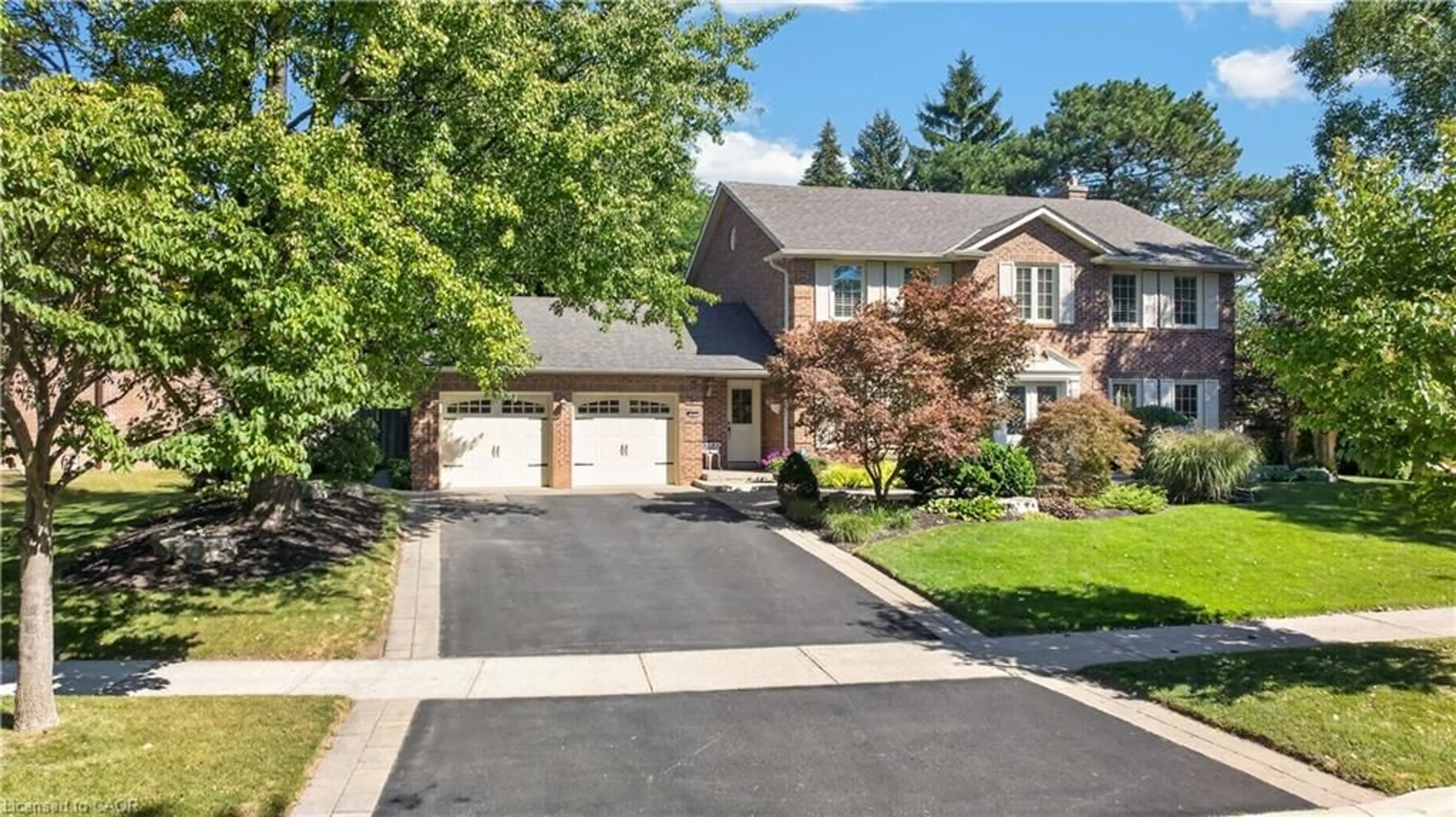 Home with brick exterior material, street for 3453 Sawmill Valley Dr, Mississauga Ontario L5L 3A3