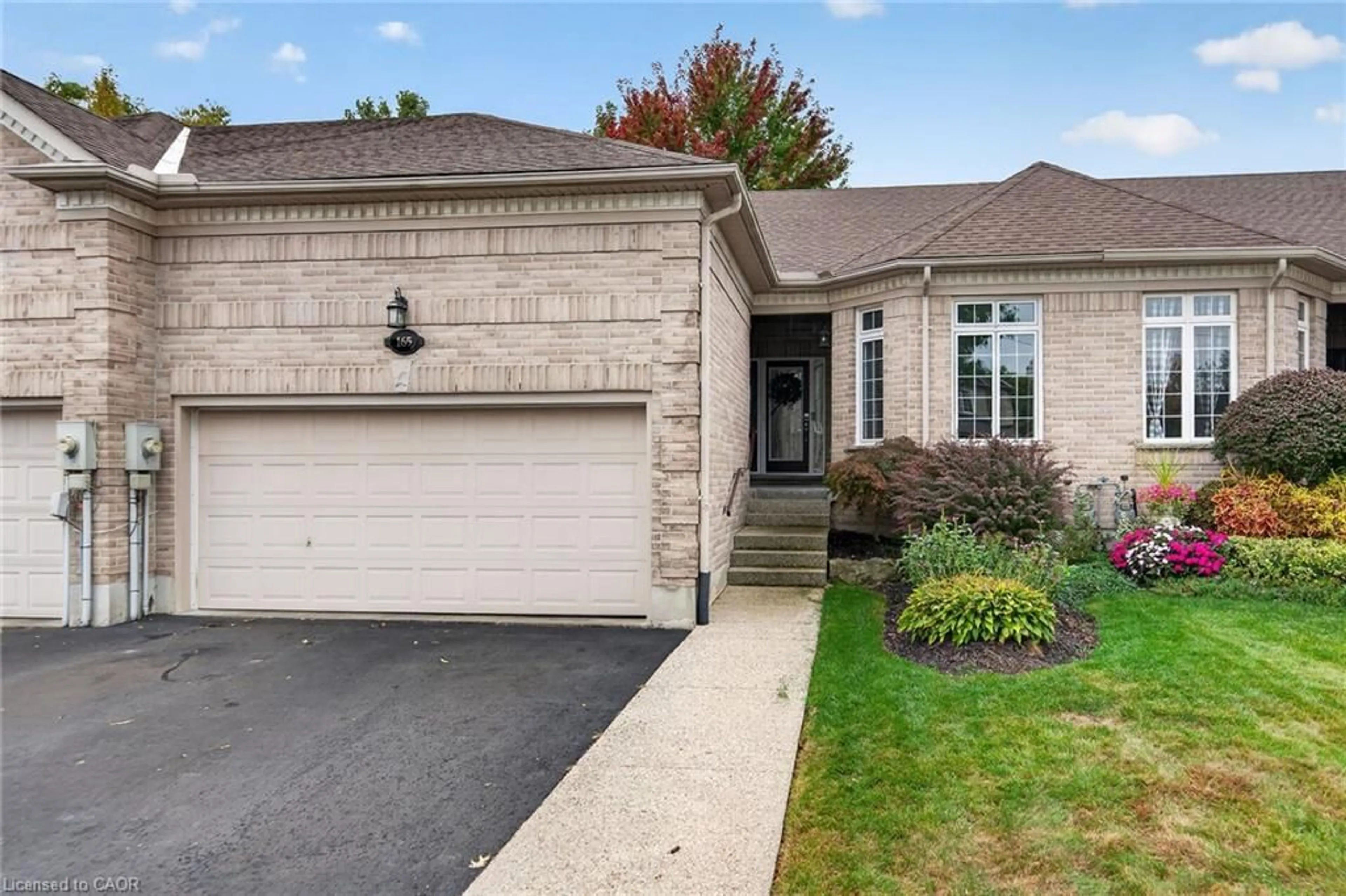Home with brick exterior material, street for 165 Doon Mills Dr, Kitchener Ontario N2P 2S1