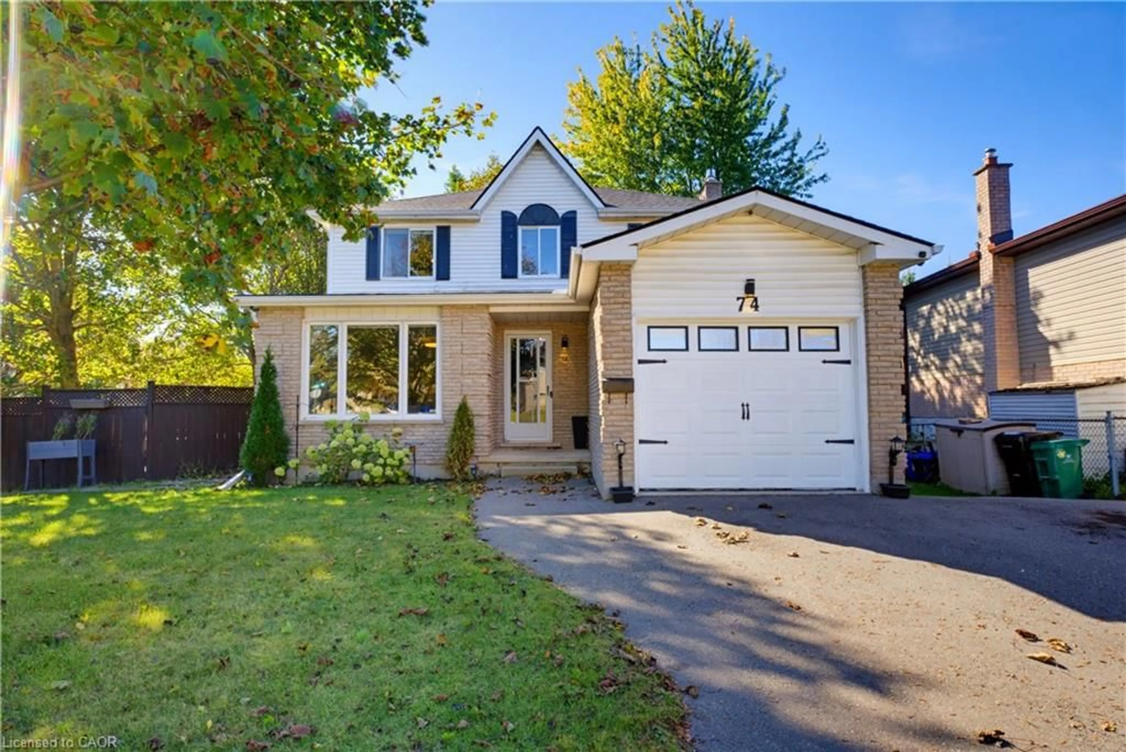 Home with vinyl exterior material, street for 74 Stirling Macgregor Dr, Cambridge Ontario N1S 4T1