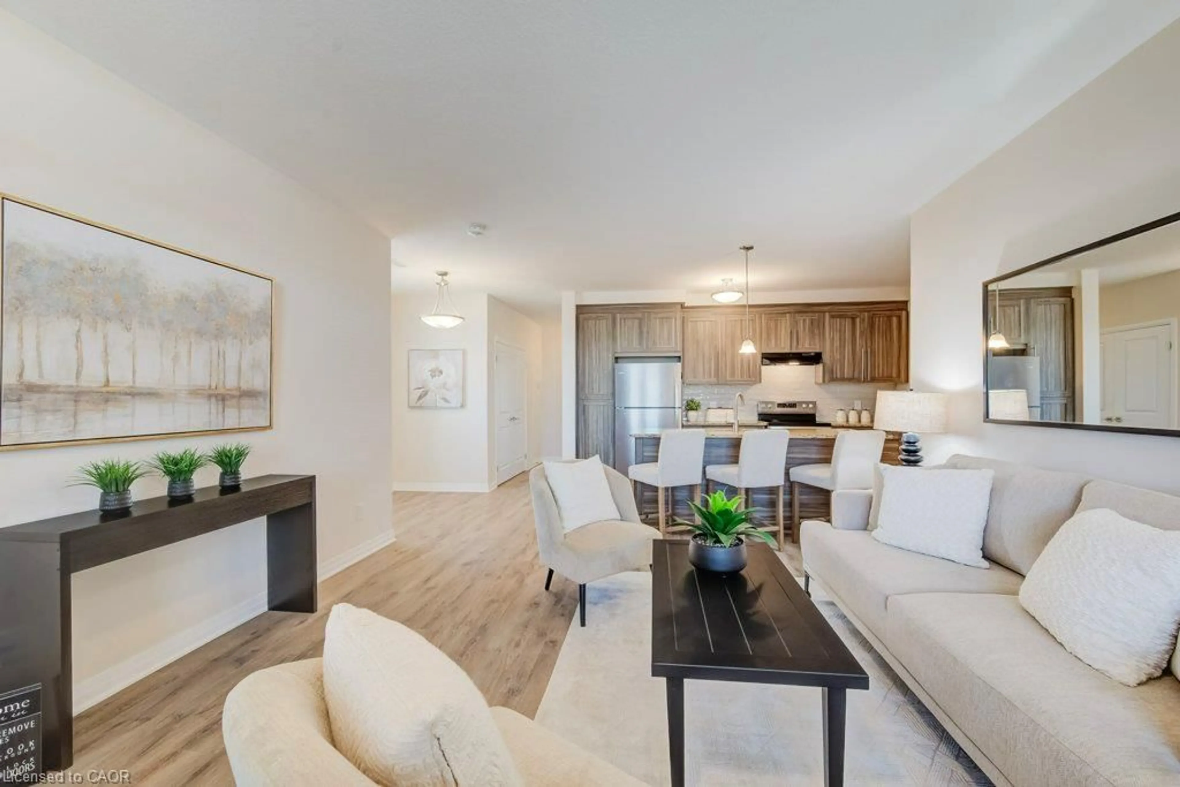 Living room with furniture, wood/laminate floor for 155 Thomas Slee Dr #3A, Kitchener Ontario N2P 2X5